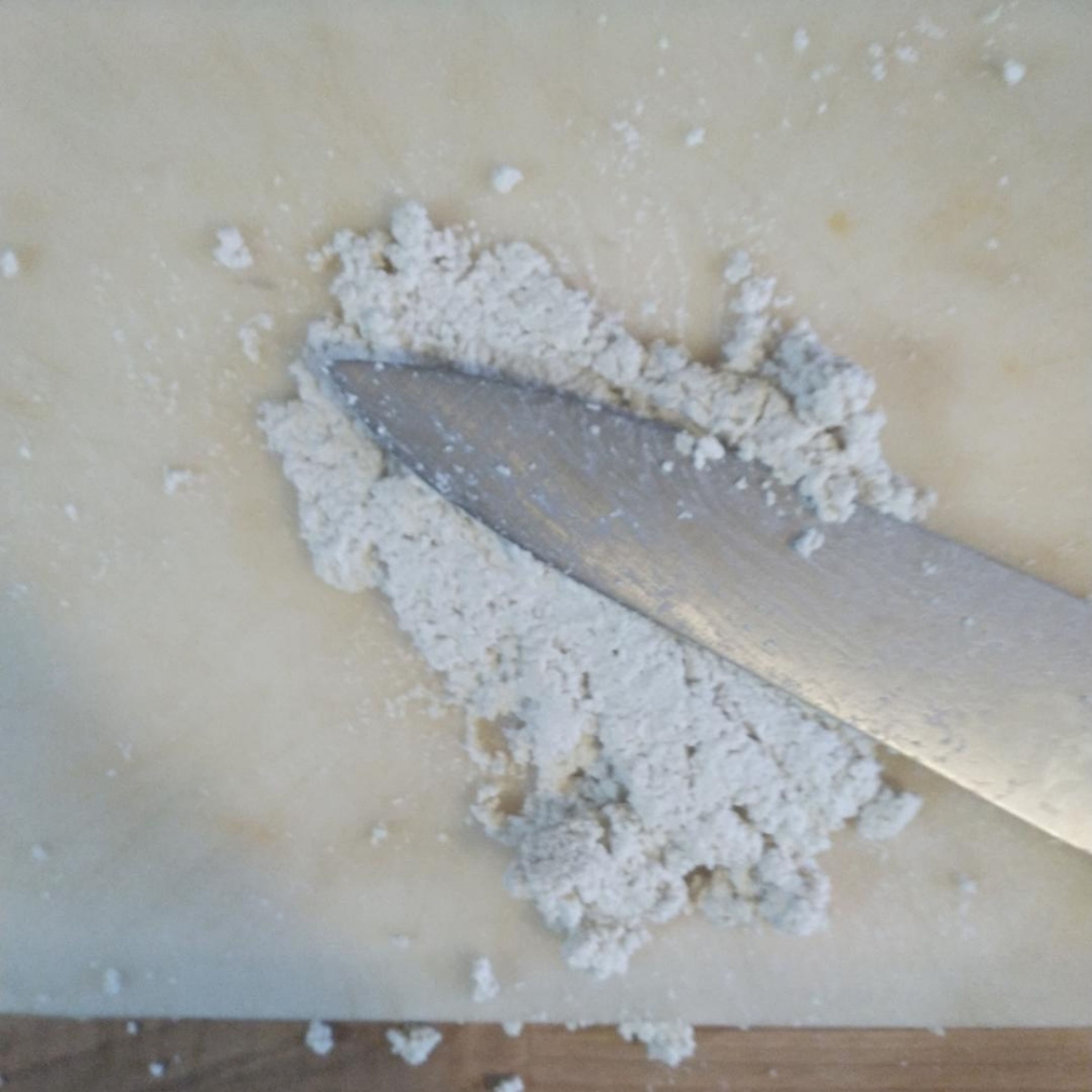 Drain the tofu. Finely chop the tofu until it is paste like, then 'mash' with the side of the knife to make a tofu paste. Add the barberries, hoisin sauce, some freshly grated nutmeg and chilli flakes.