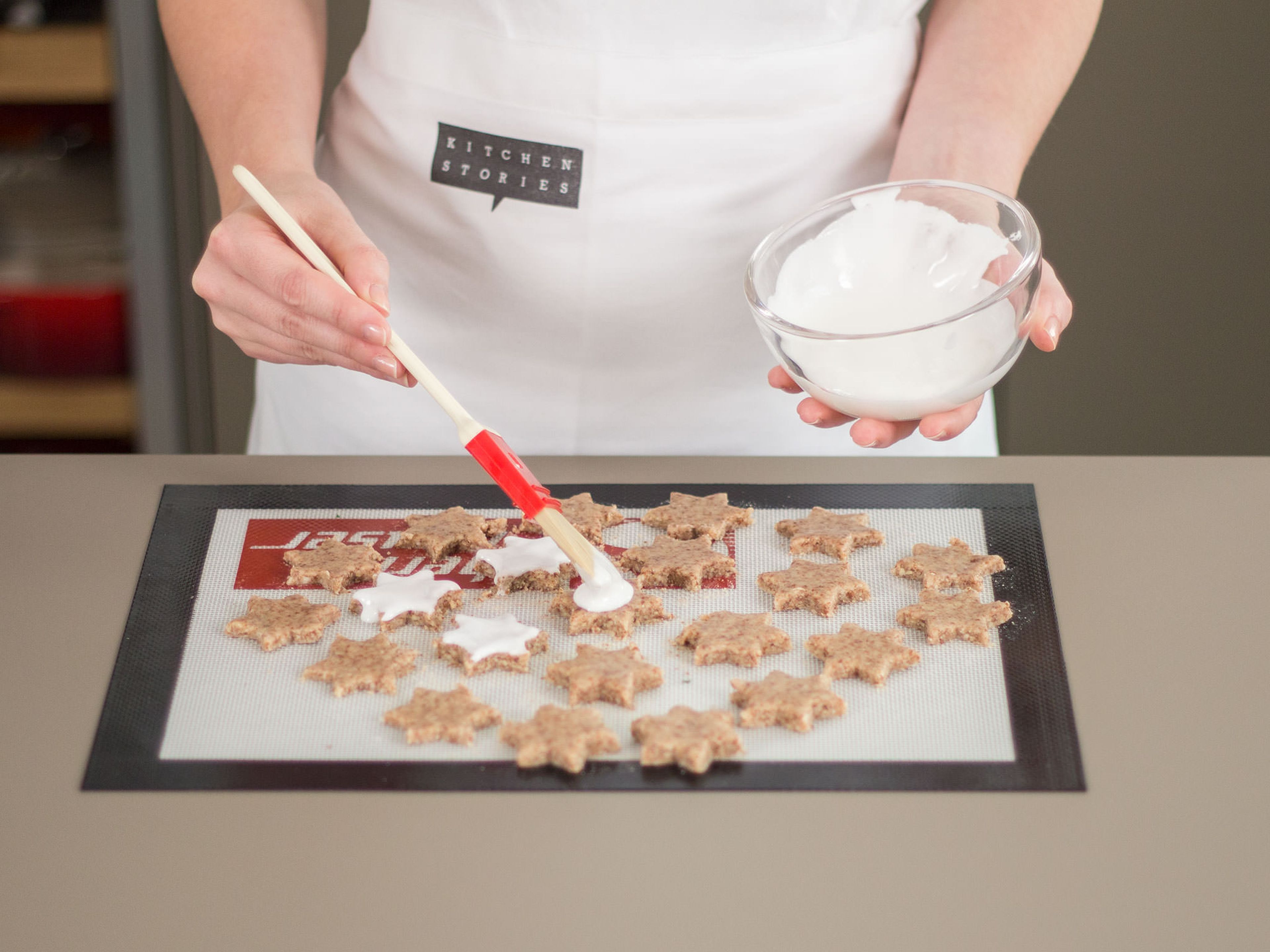 Roll dough out between some plastic wrap to avoid sticking. Using a cookie cutter, cut out star-shaped cookies and transfer to a lined baking sheet. Brush with meringue and bake in preheated oven at 150°C/300°F for approx. 15 – 20 min.