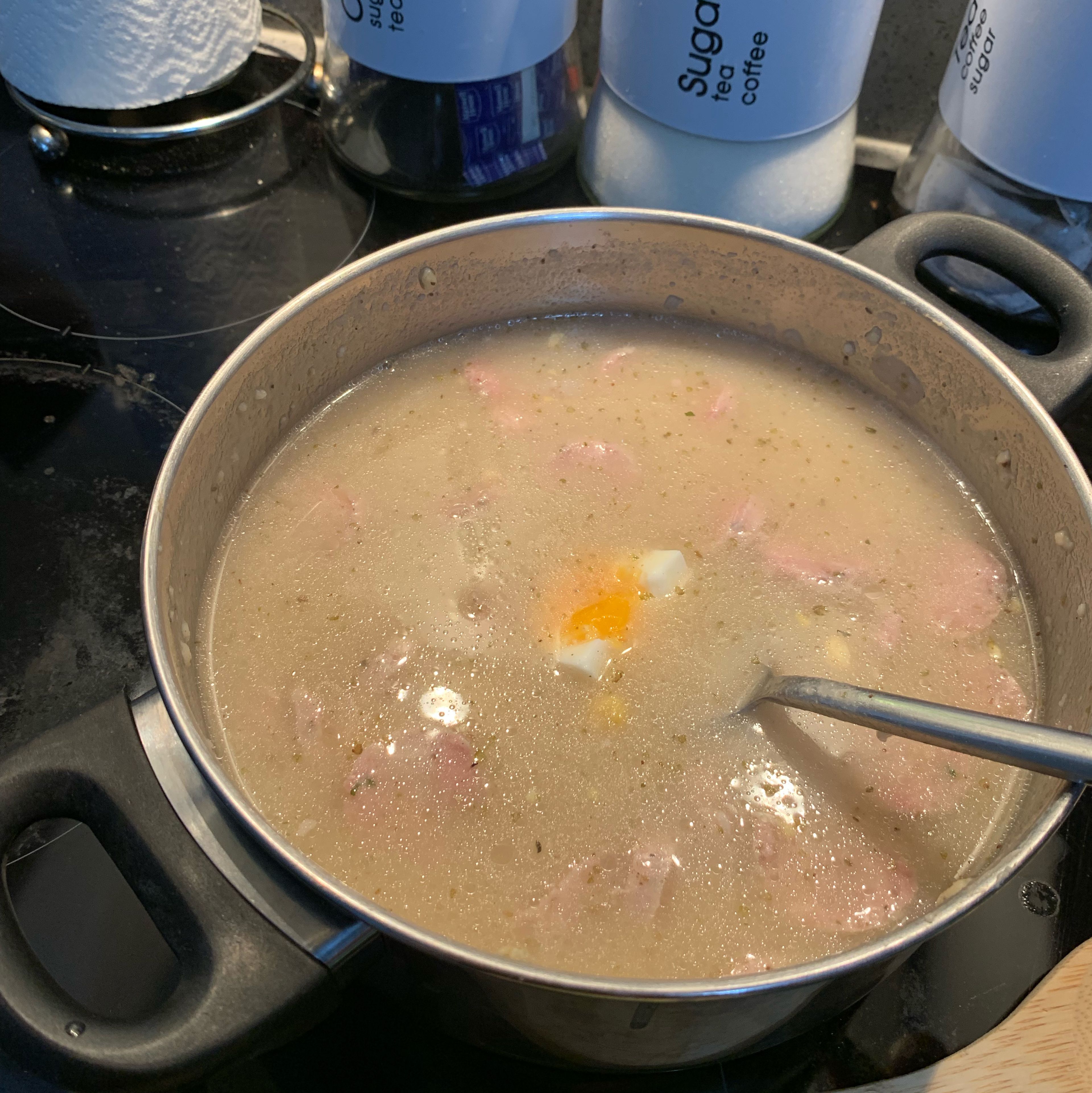 Cut the previously hard boiled eggs into halves or quarters and add to the soup.