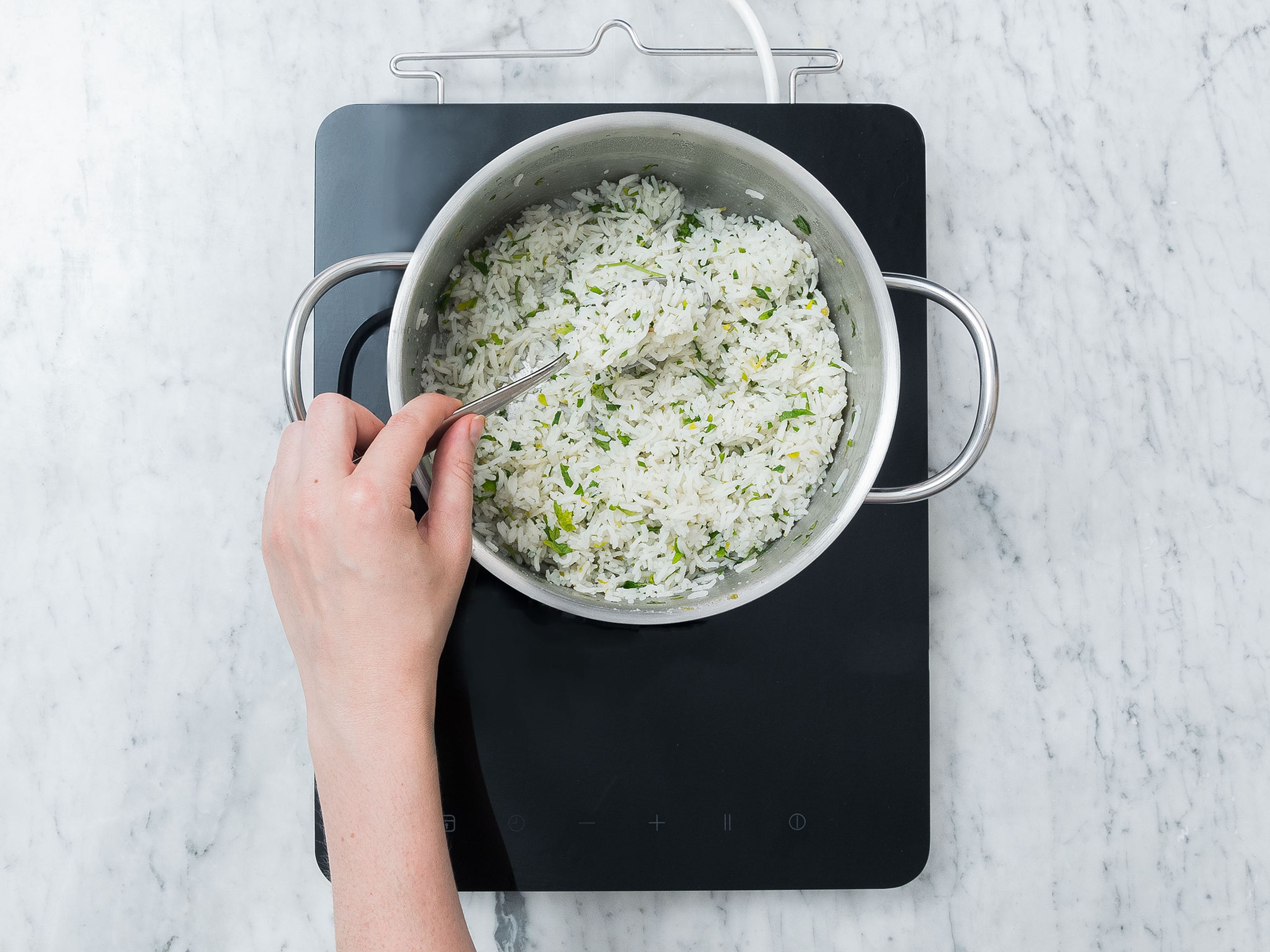 Finely chop parsley. Add basmati rice and water to a medium saucepan and salt. Bring to a boil, then reduce heat and let simmer for approx. 20 min. or until rice is done. Add lime zest, lime juice and chopped parsley and stir to combine.