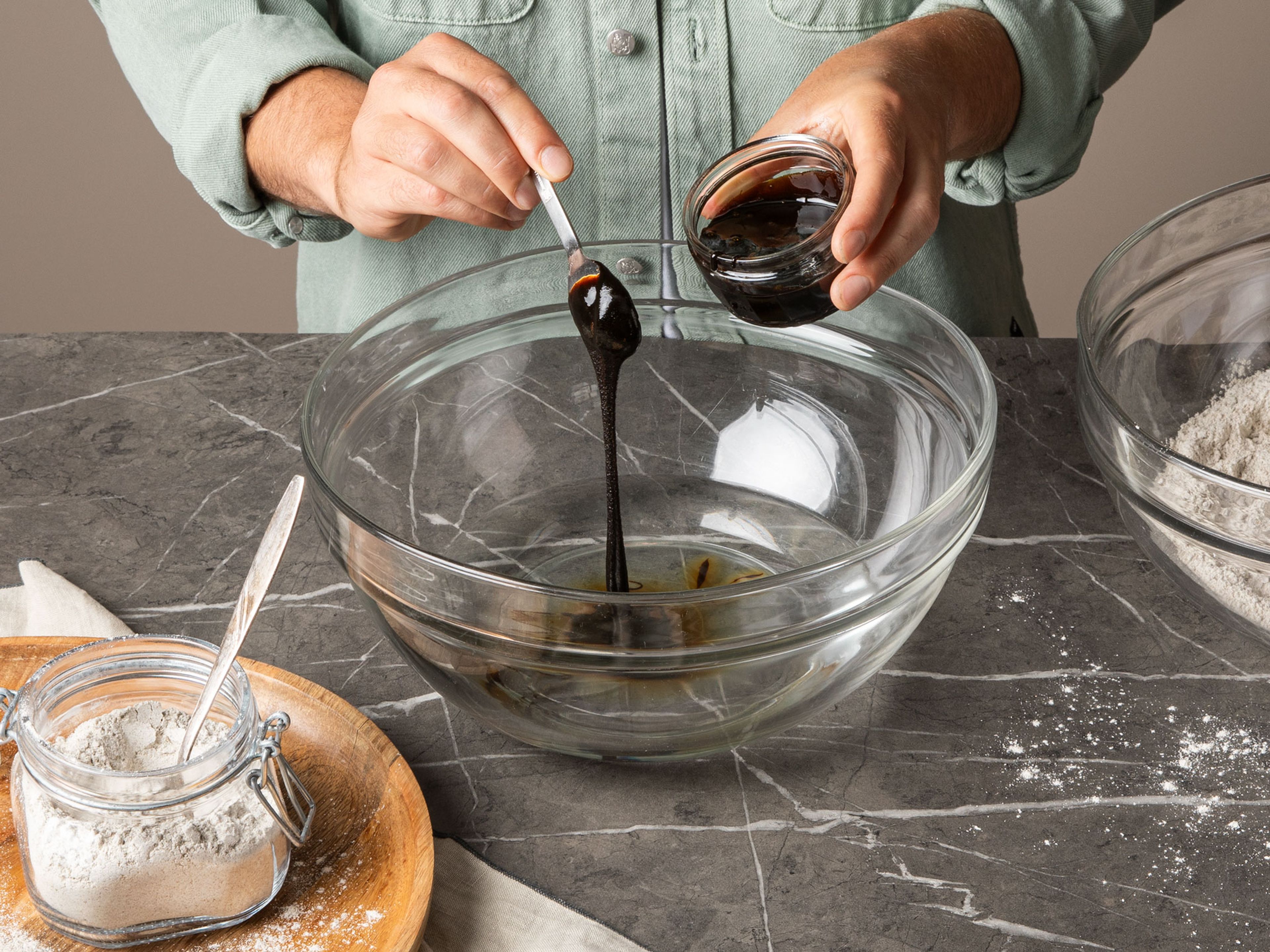 In a bowl, mix the flour with salt. In a separate, large bowl, whisk the molasses into the water until fully dissolved.