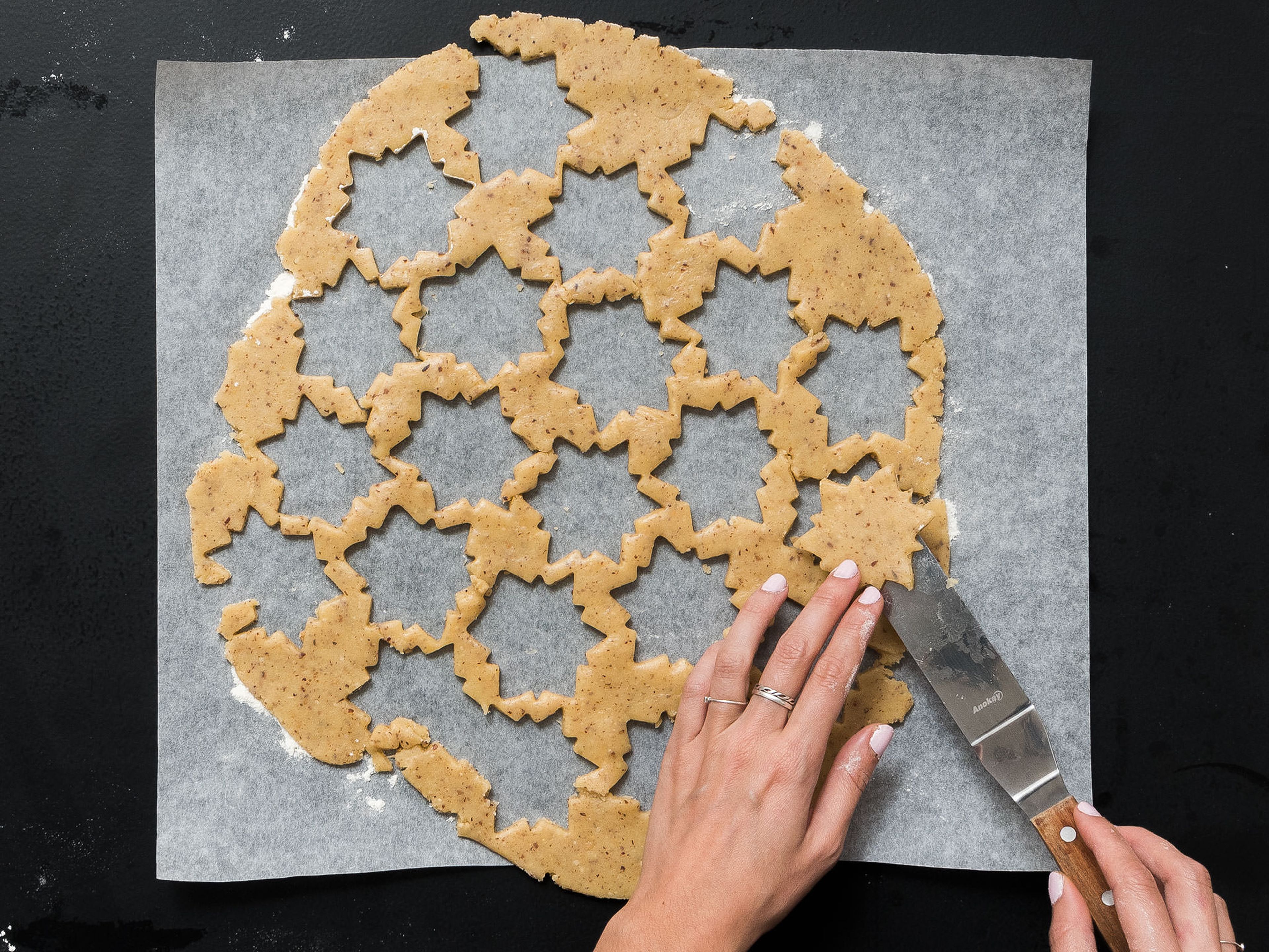 Pre-heat oven to 180°C/350°F. Flour working surface and roll out dough until approx. 2-mm/0.1-inch thick. Use a cookie cutter to cut out cookies and place the cookies onto a parchment-lined baking sheet. Use a small round cookie cutter to cut a hole out of the center of half of the cookies. Transfer to oven and bake at 180°C/350°F for approx. 15 min., or until golden brown. Remove from oven and leave to cool.
