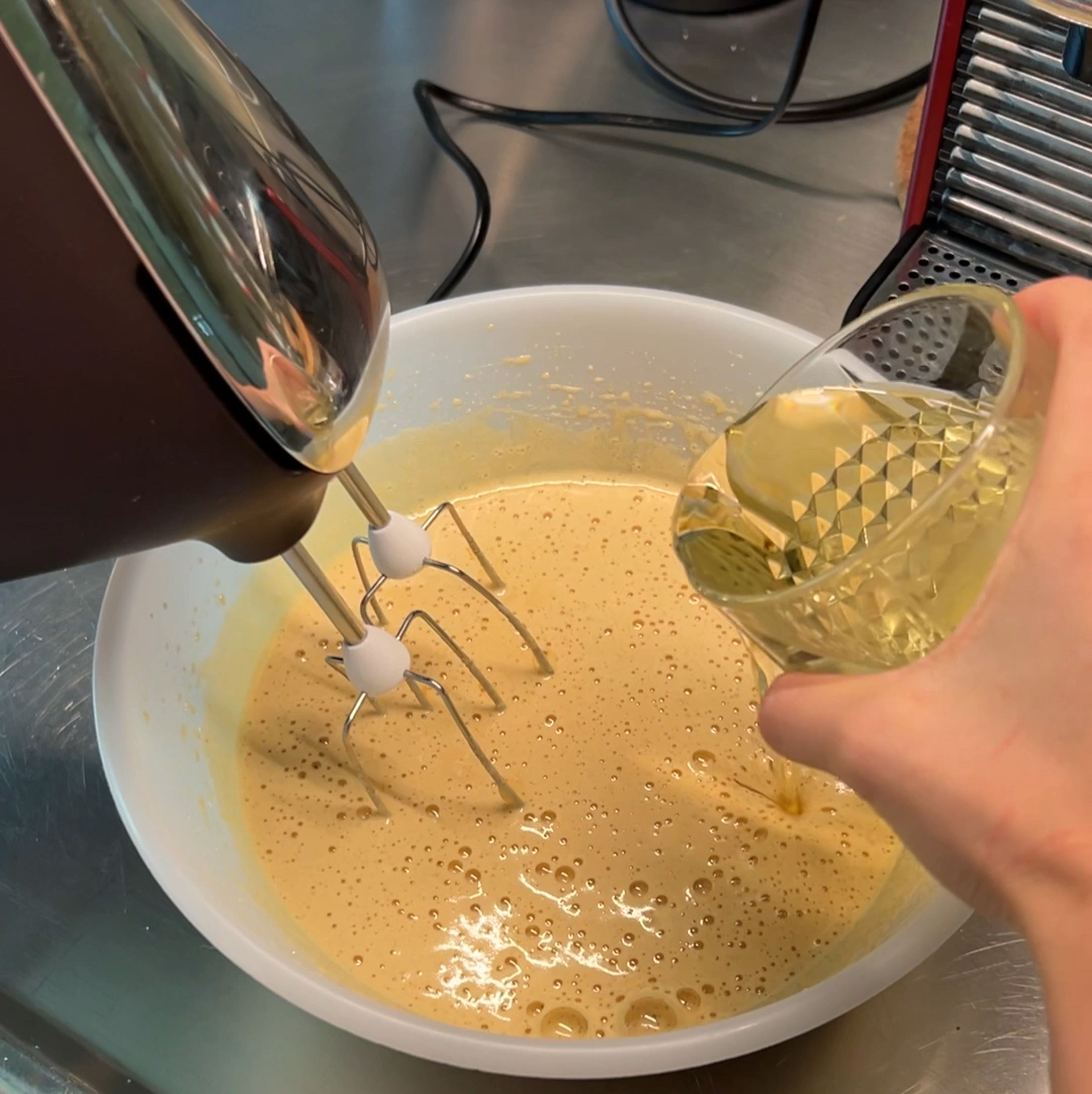 Slowly pour vegetable oil to the wet mixture while whisking.  