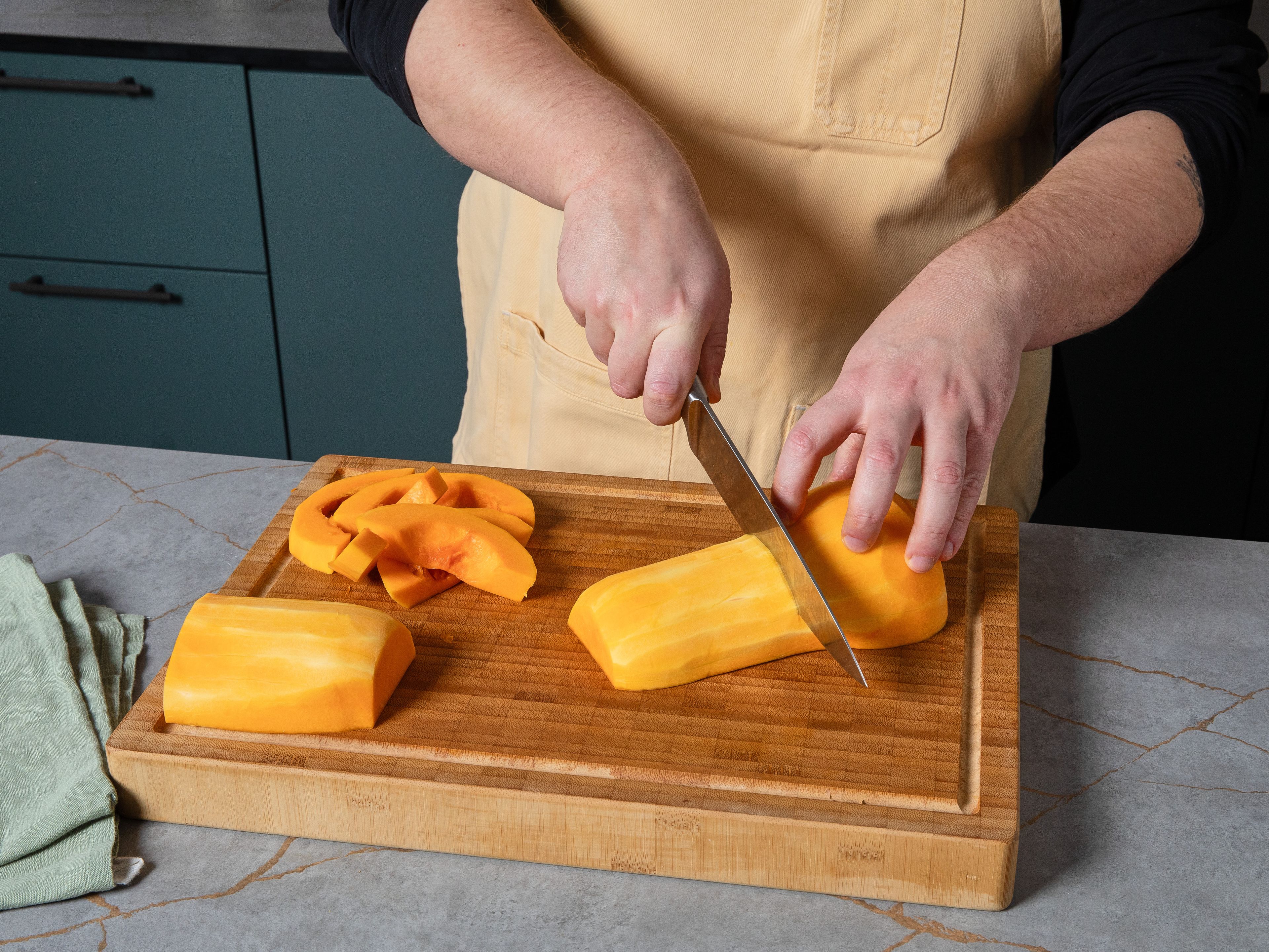 Preheat the oven to 200°C/390°F. Halve, deseed and peel butternut squash. Separate and cube cavity part. Season squash with salt and pepper and toss with some olive oil. Bake at 200°C/390°F for approx. 30 min. Meanwhile peel and finely dice shallots, peel and finely mince garlic and slice mushrooms. After the baking time, add walnuts to the baking sheet with squash and bake for approx. 5 min. more. Remove from the oven and set aside.