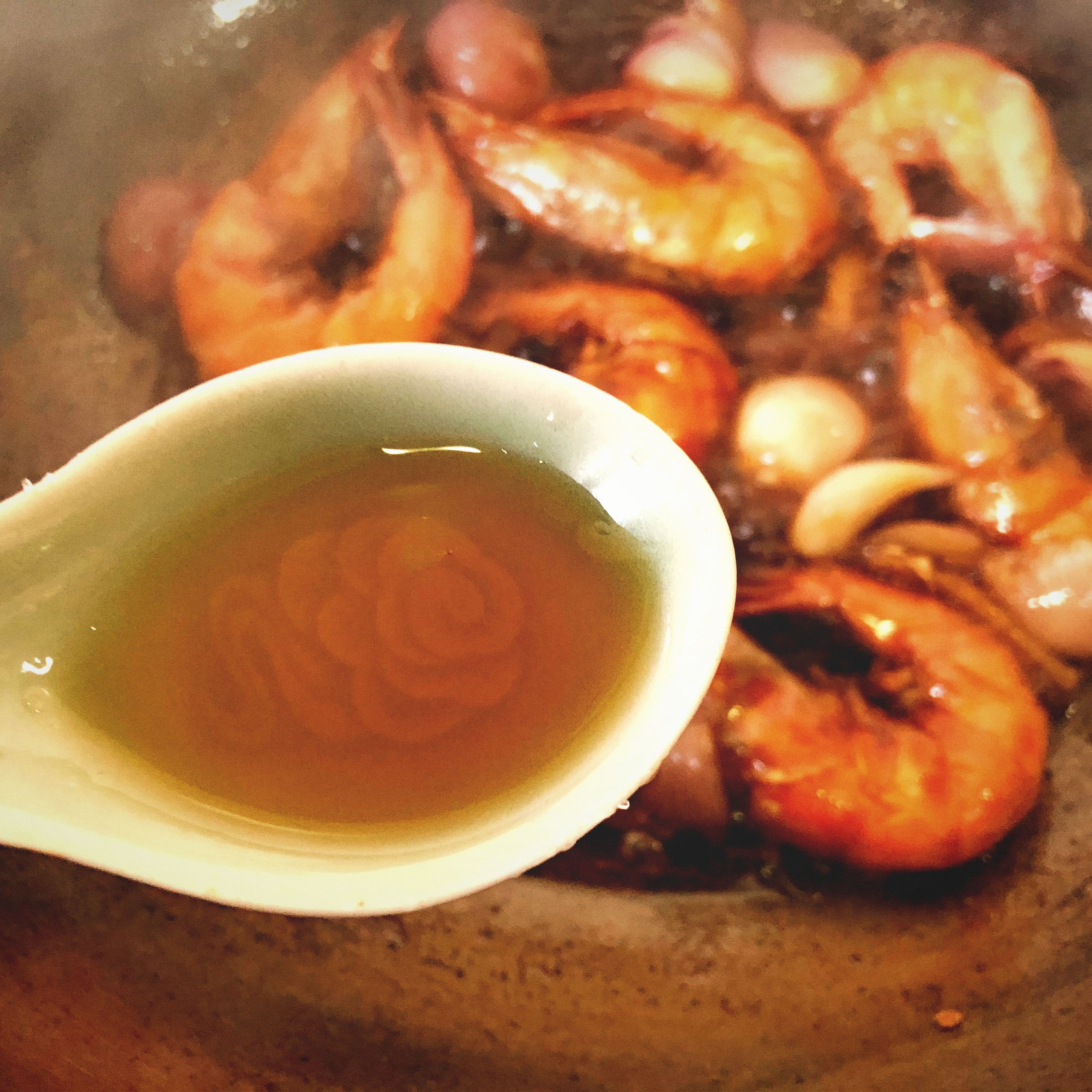 After opening the lid, pour in the sesame oil.