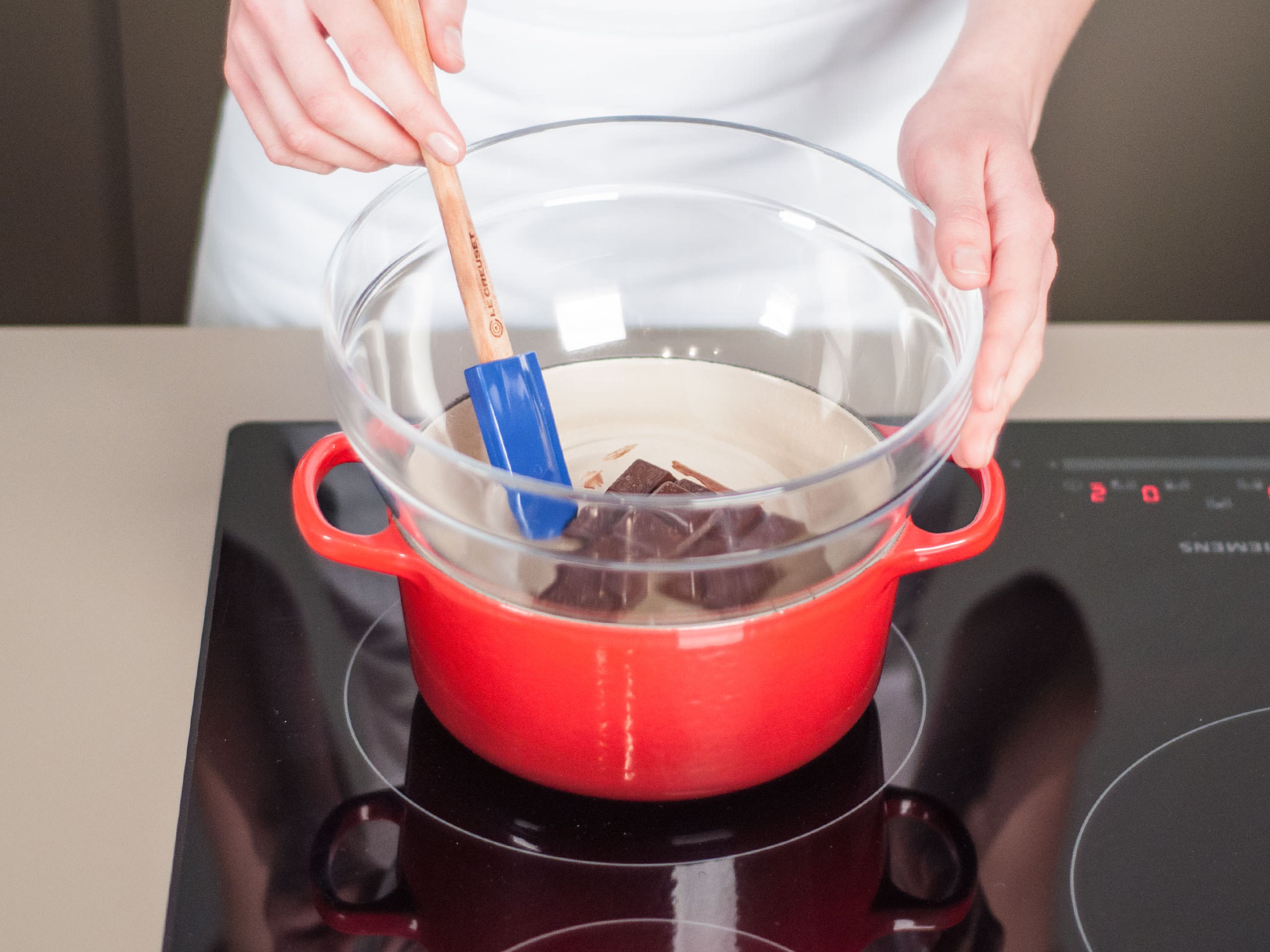 Melt the bittersweet chocolate in a double boiler. Set aside.
