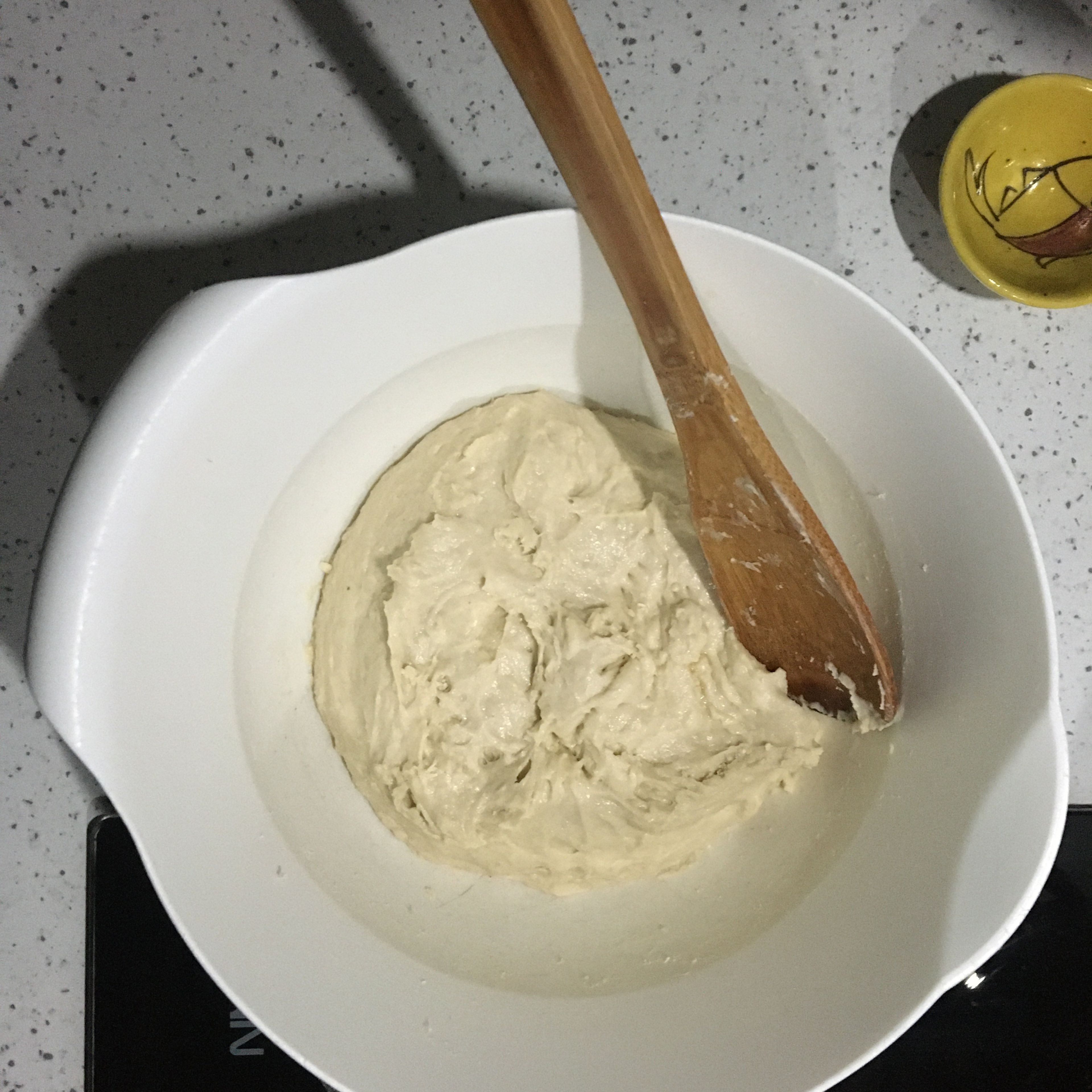 This bread is an overnight risen one, so the dough is being made the night before. In a large bowl, briefly whisk together the flour, wheat bran and oat flour. Add the yeast, date juice, water and salt incorporating all together with a wooden spoon until an even sticky yet smooth dough comes together.
