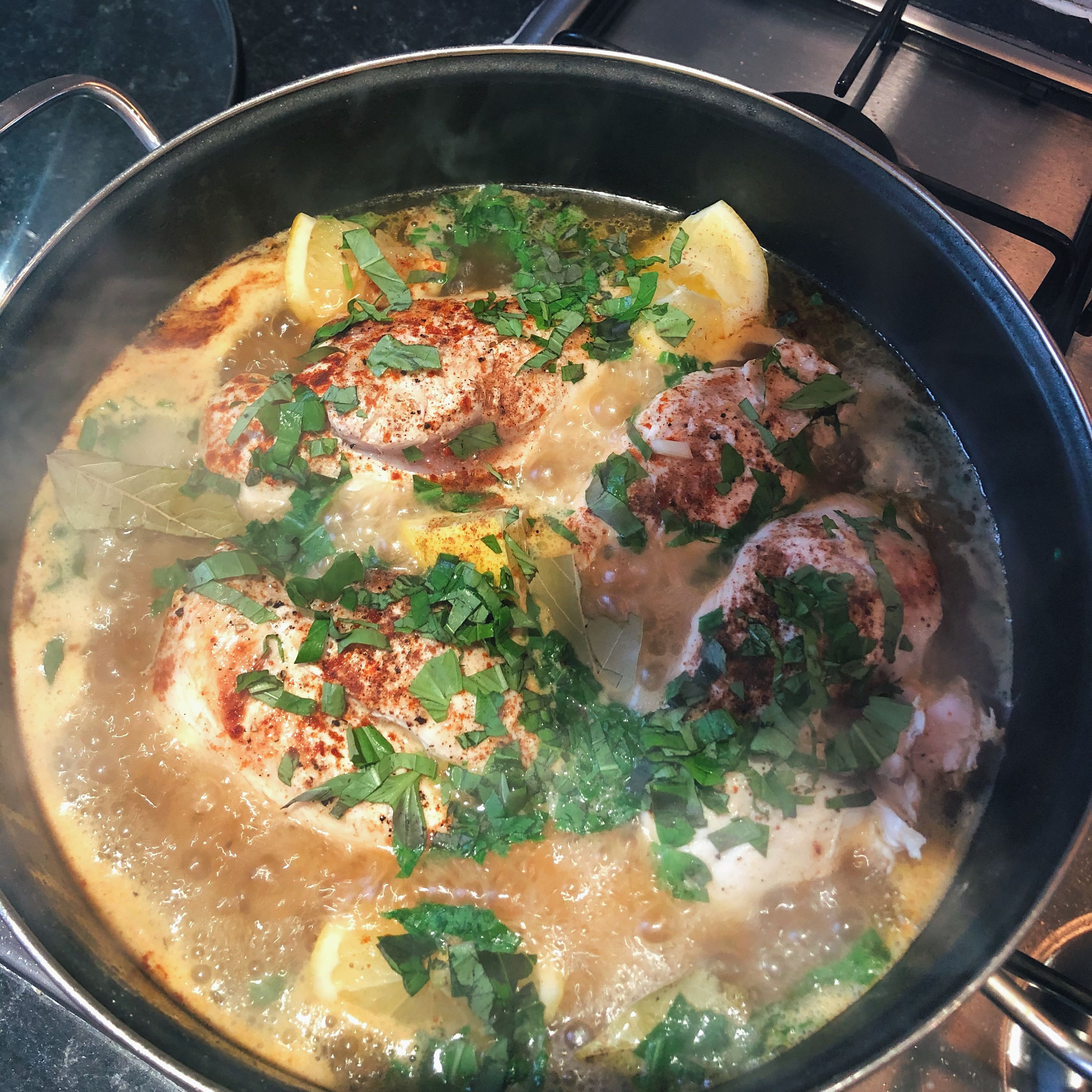 Quarter the lemon, roughly chop onion basil and chives, crush garlic and add to the pan with chicken stock, sugar, bay leaves, nutmeg, paprika and oregano. Season with salt and pepper. Then put lid on and simmer over medium heat for 8 minutes. Stir occasionally.