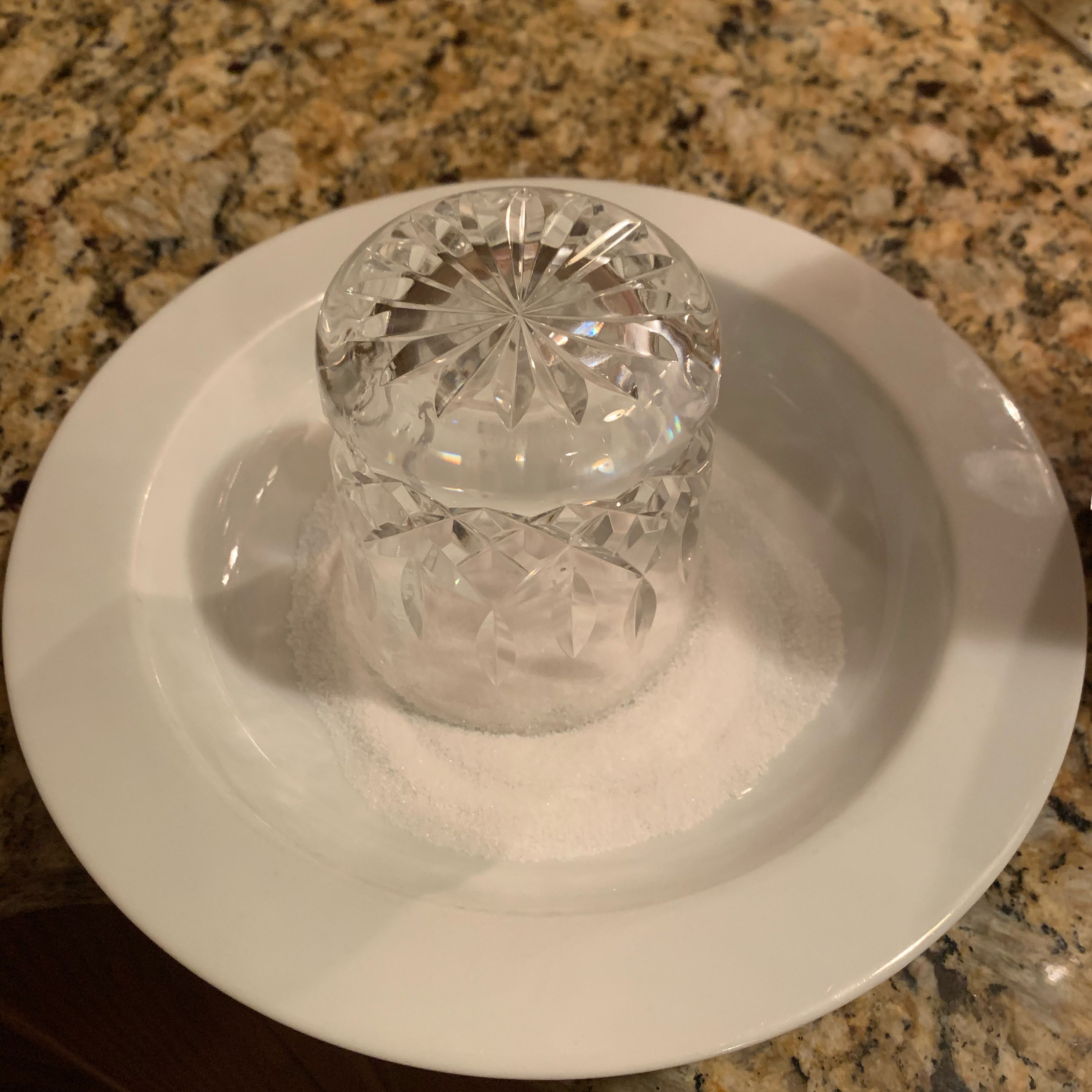 Coat rim of glass with remaining lemon juice and dip into sugar.