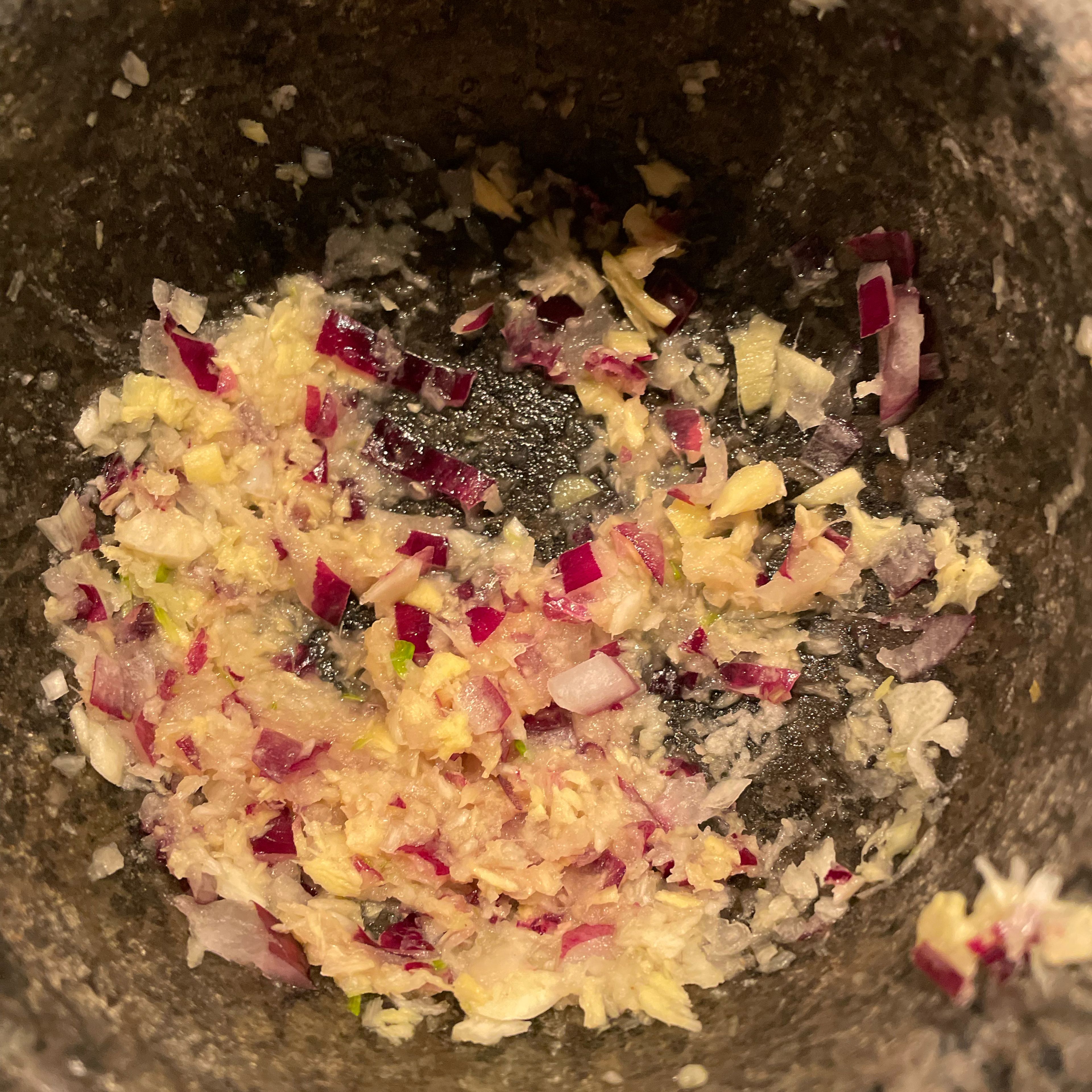 Pound remaining red onion, garlic and ginger with pestle and mortar to a paste.
