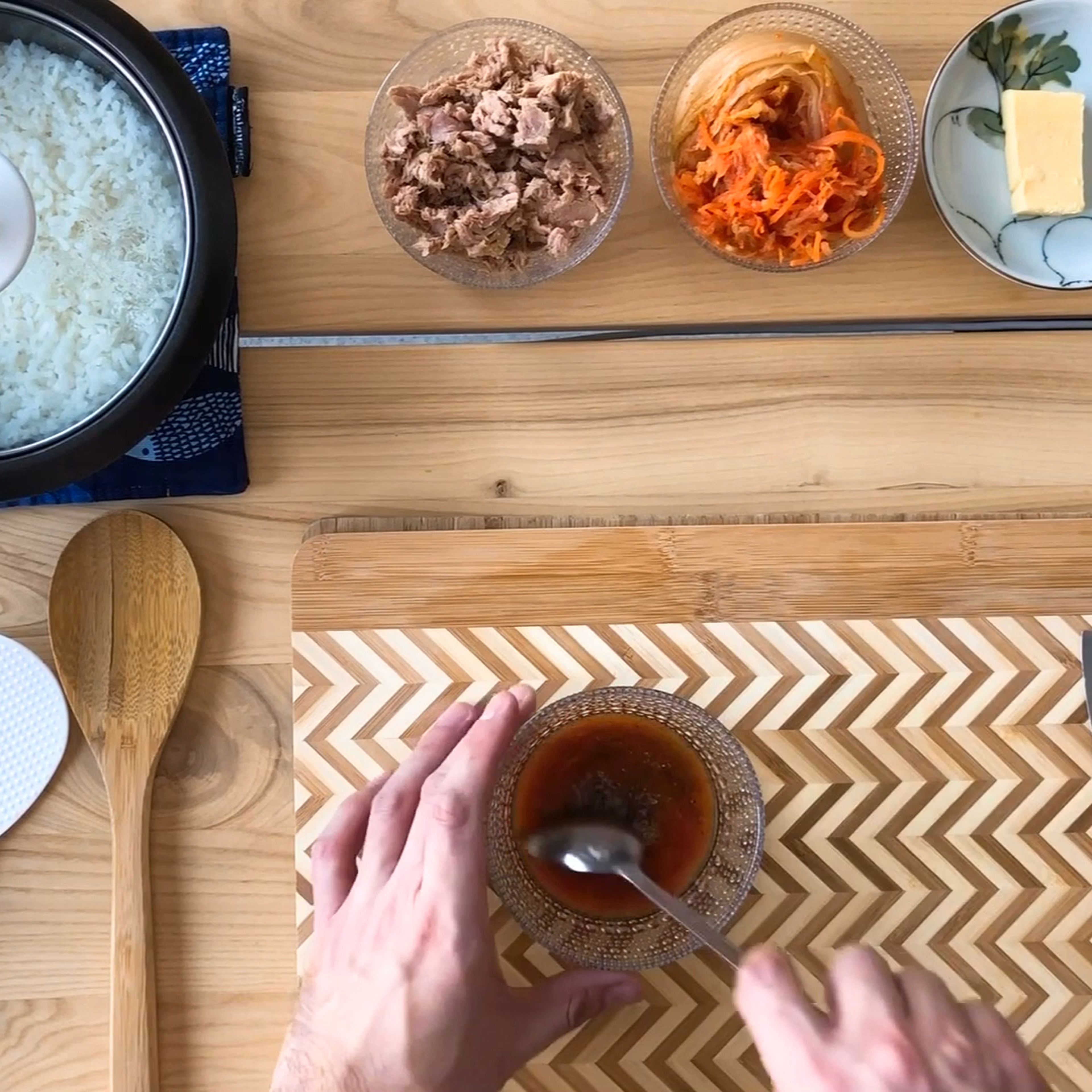 If you don’t have leftover cooked rice, go ahead and prepare that first. Next we’ll prepare the sauce for the fried rice. Do this by mixing the kimchi juice, soy sauce, corn syrup and black pepper together. Kimchi juice is one of this recipe’s secret ingredients so don’t forget it!