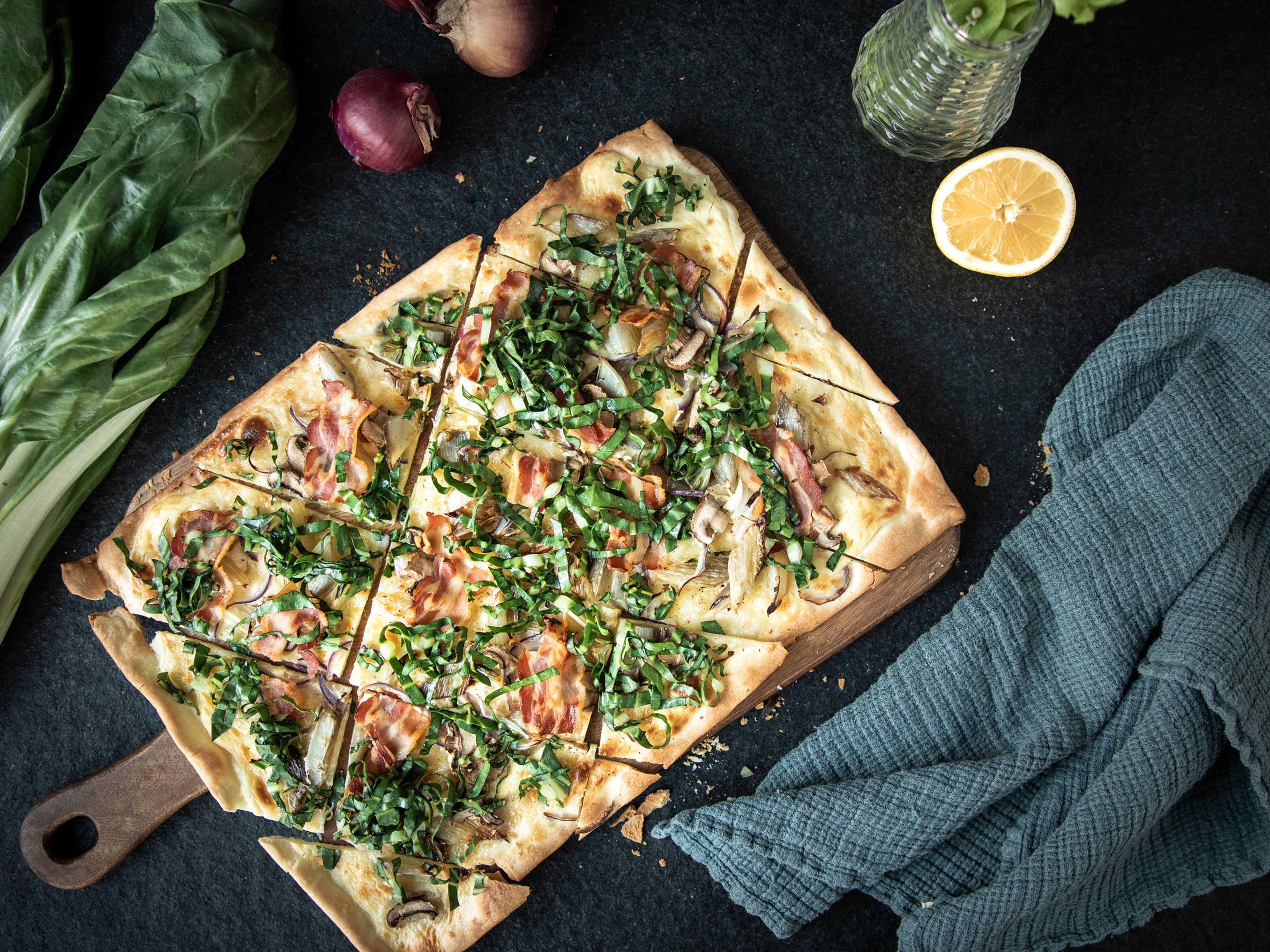 Tarte flambée with Swiss chard, mushrooms, and bacon