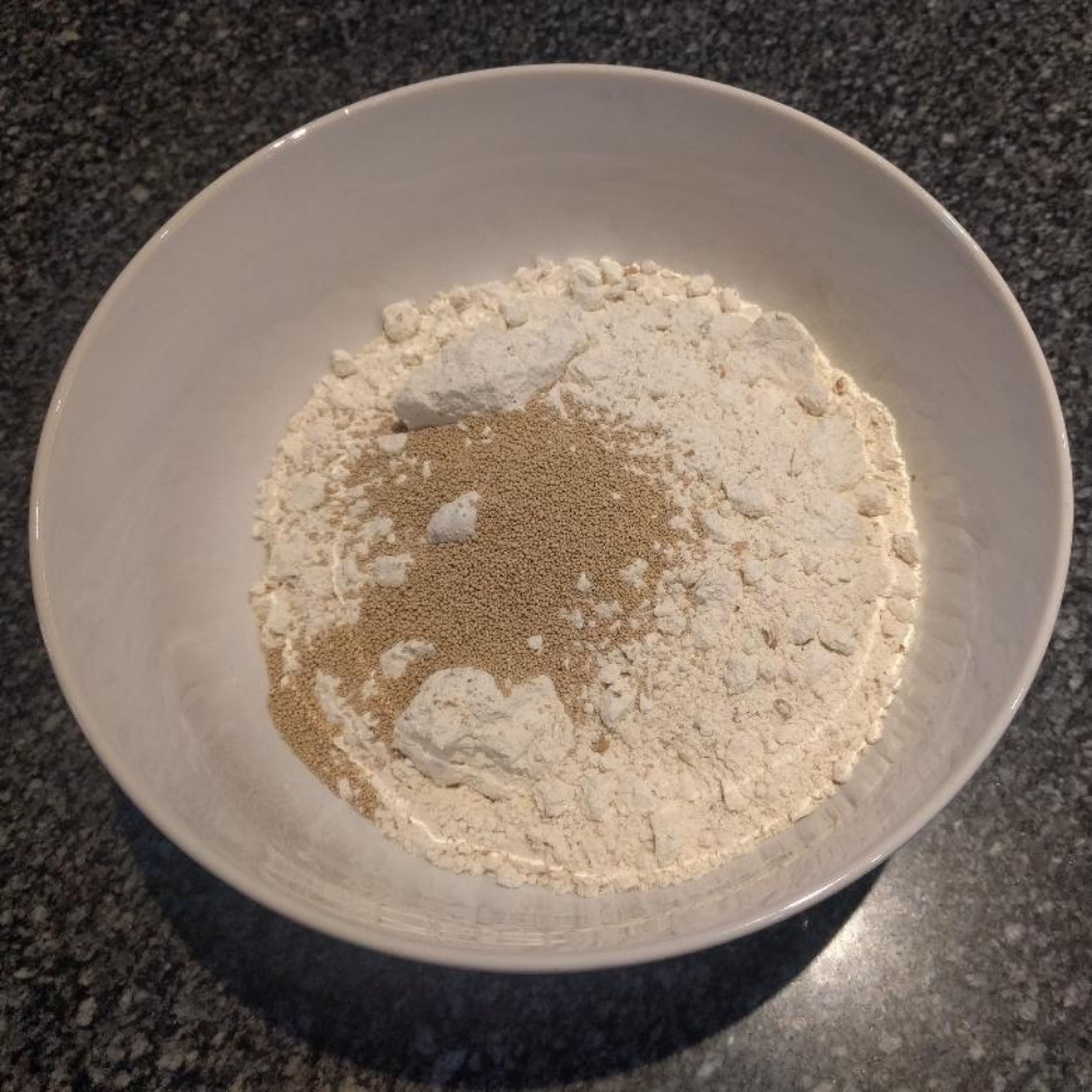 Mix bread flour, active dry yeast, and salt in a large bowl.