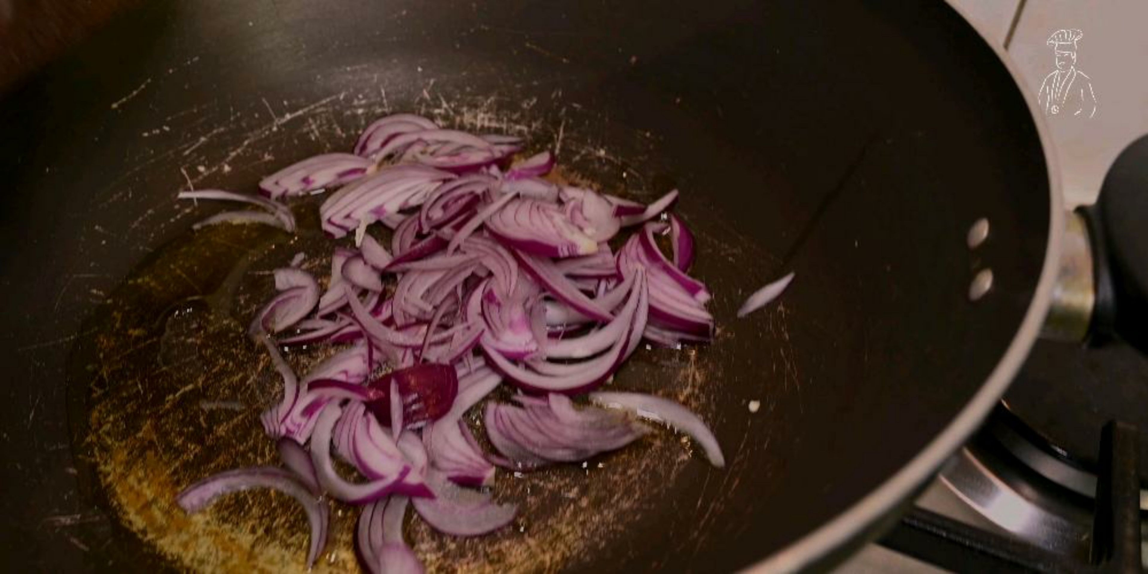 In a large wok, heat 1 tbsp. of olive oil and simmer the onions for 1-2 minutes. 

Then add the garlic and green chillies and mix the ingredients together and simmer for another 2-3 minutes.