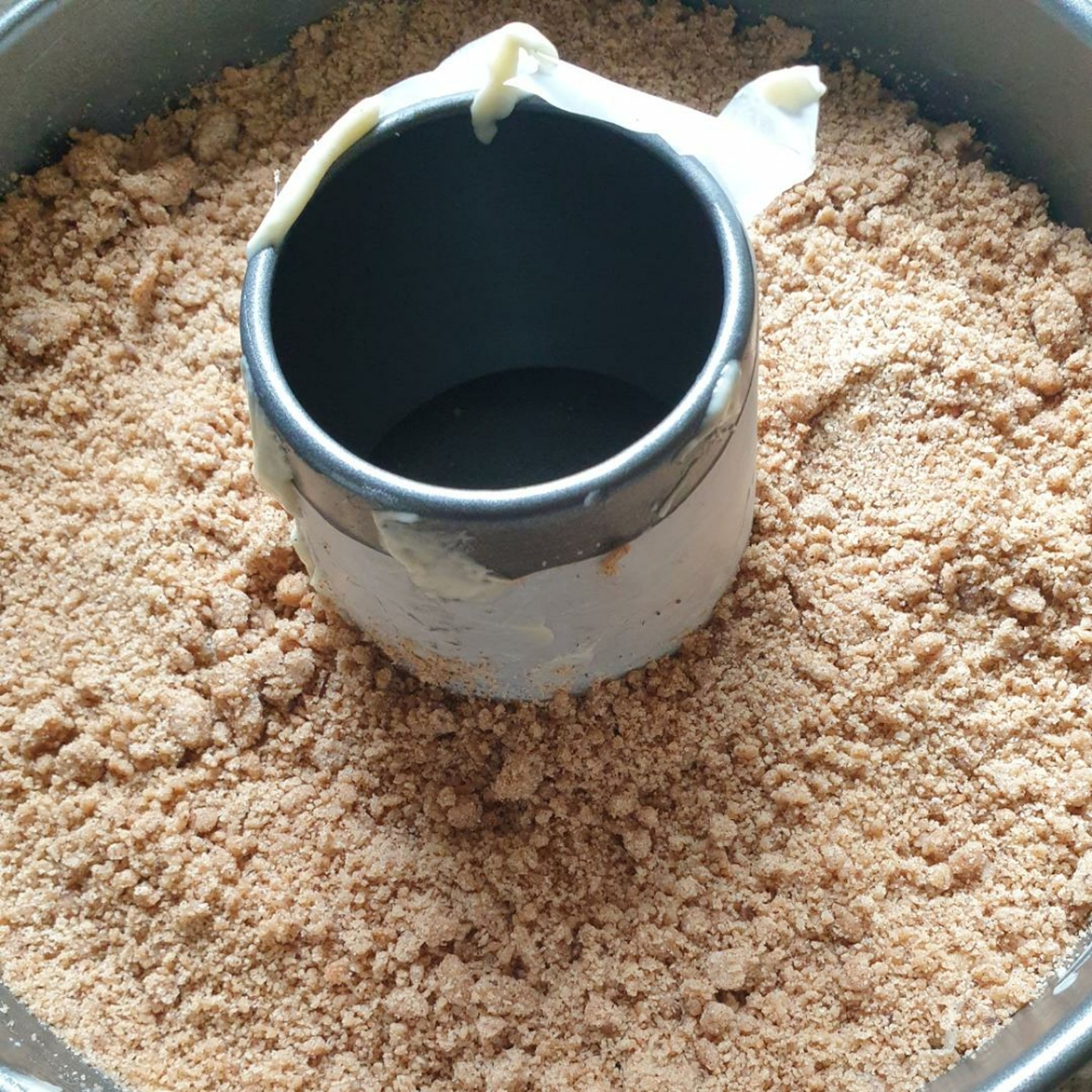 Sprinkle the prepared Streusel mixture evenly on top of the cake batter.