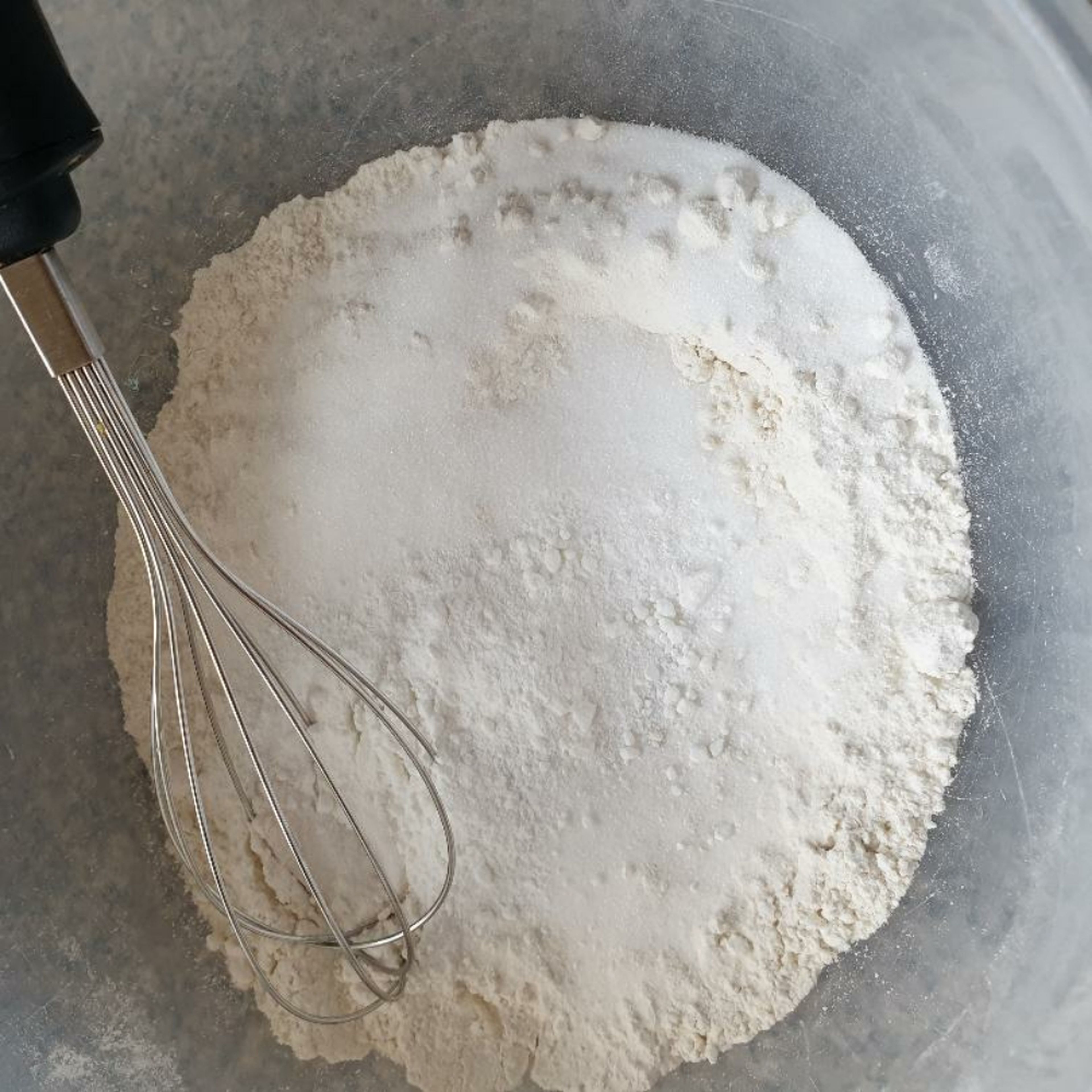In a large bowl, sift flour, baking powder and caster sugar and give a little whisk to combine.