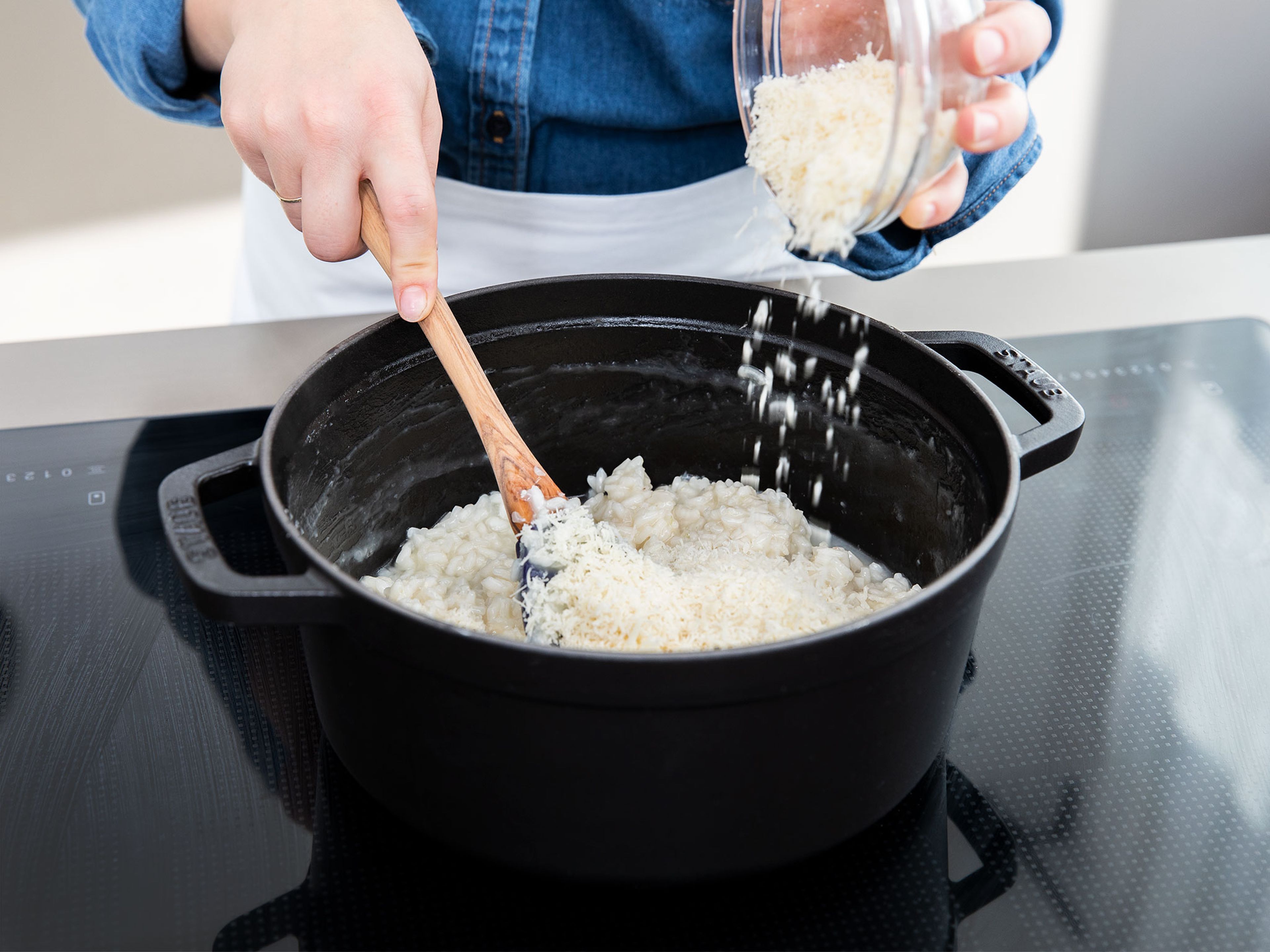 As soon as  the risotto rice has soaked up all liquid and reached the perfect tender texture, add freshly grated Parmesan cheese and half of the butter. Season with salt and pepper to taste. Set aside.