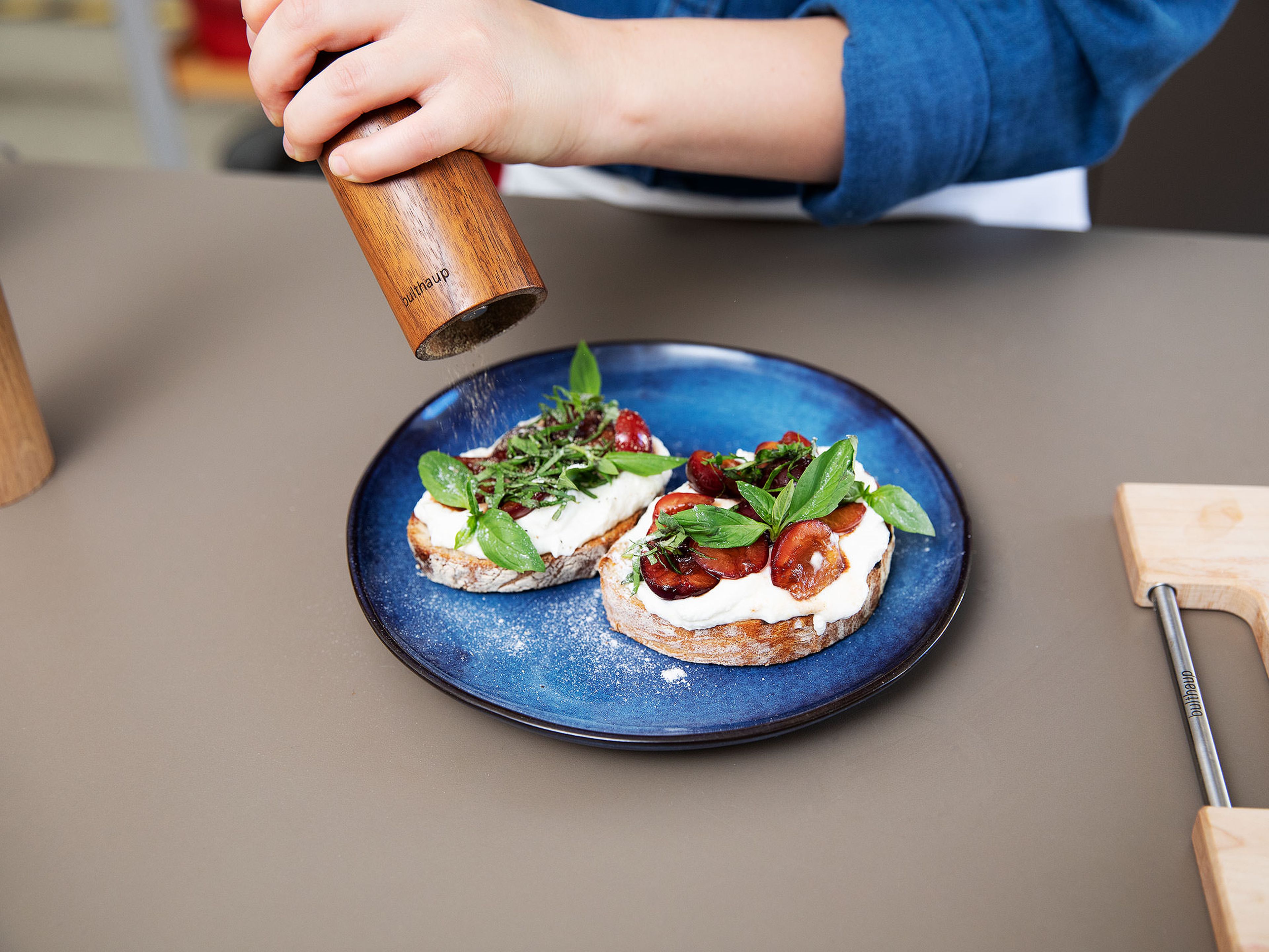 Heat a grill pan over medium-high heat and toast bread slices on both sides until light brown. For serving, spread the toasted bread with some of the whipped ricotta, top with balsamic cherries, and sprinkle with any remaining sauce. Garnish with sliced basil and enjoy!