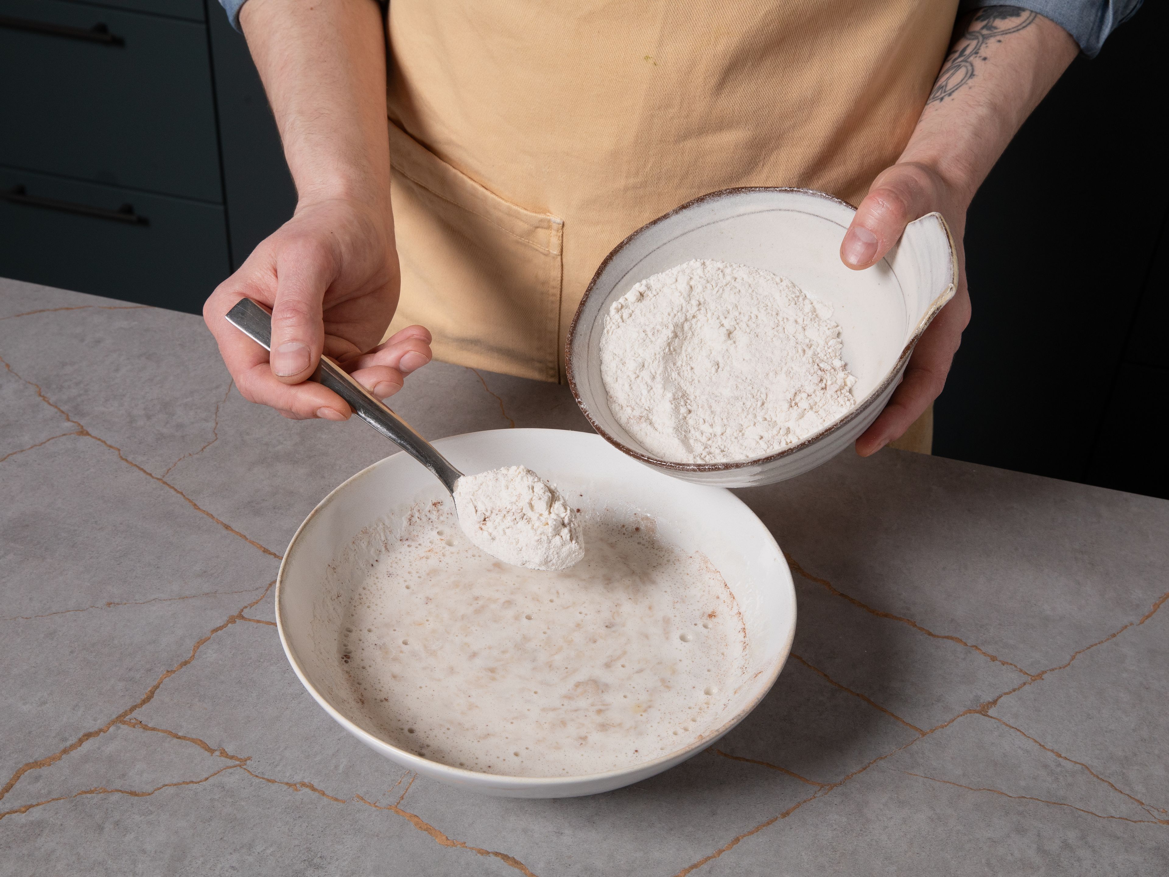 Sift in flour, baking powder, cinnamon, and salt into a separate bowl. Add to the wet ingredients and stir until you have a smooth batter.