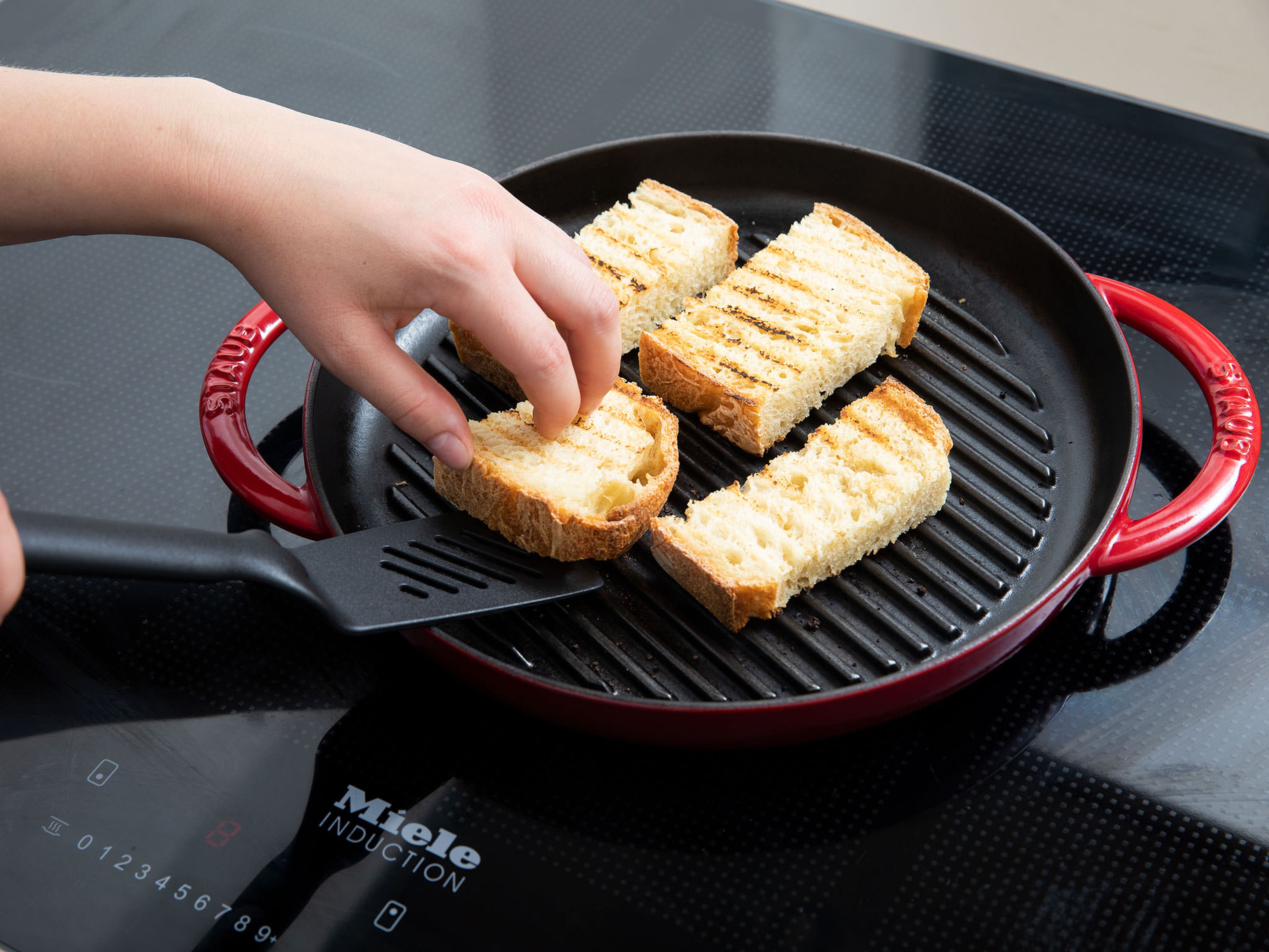 Cut bread to desired size. Toast bread in grill pan over medium-high heat.