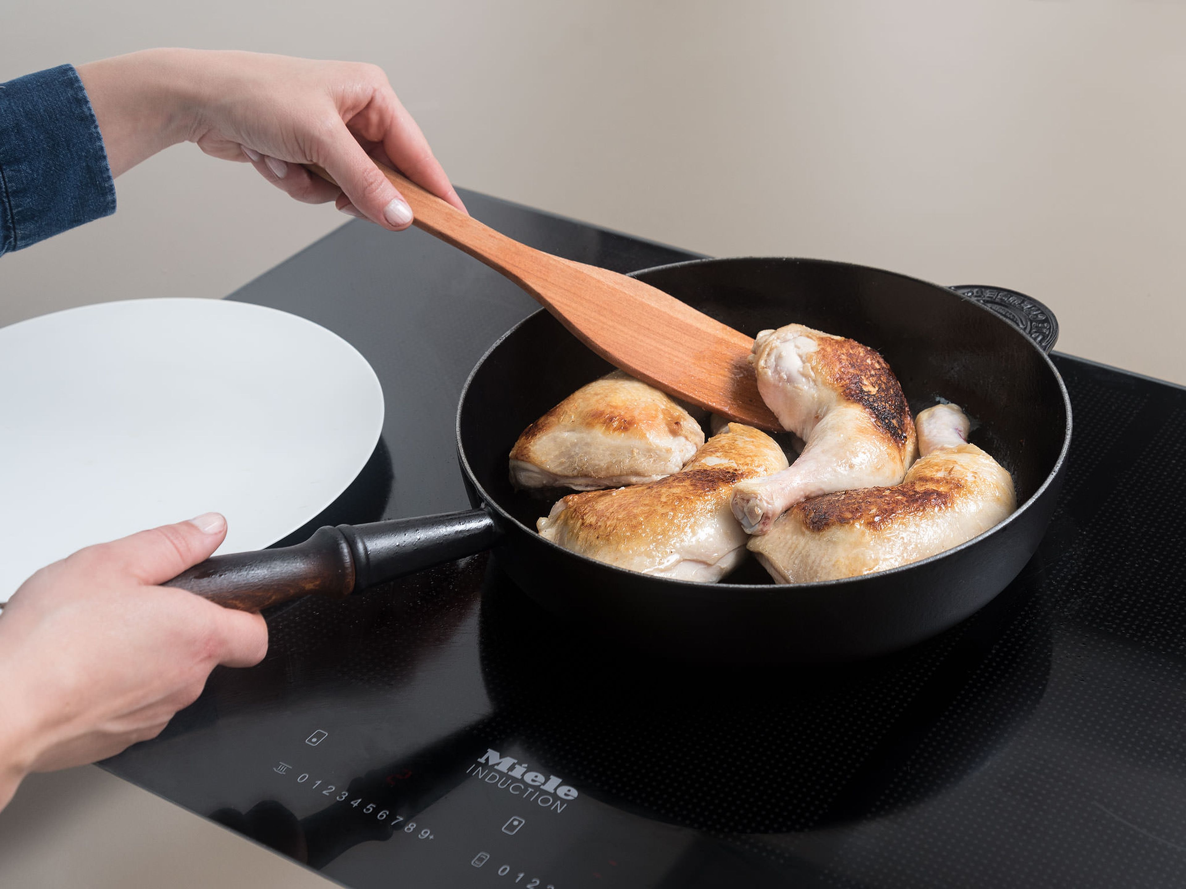 Pat chicken legs dry with a paper towel, then season with salt and pepper. Heat a large ovenproof frying pan over medium-high heat. Add olive oil and chicken and cook until browned on all sides. Transfer to a plate.