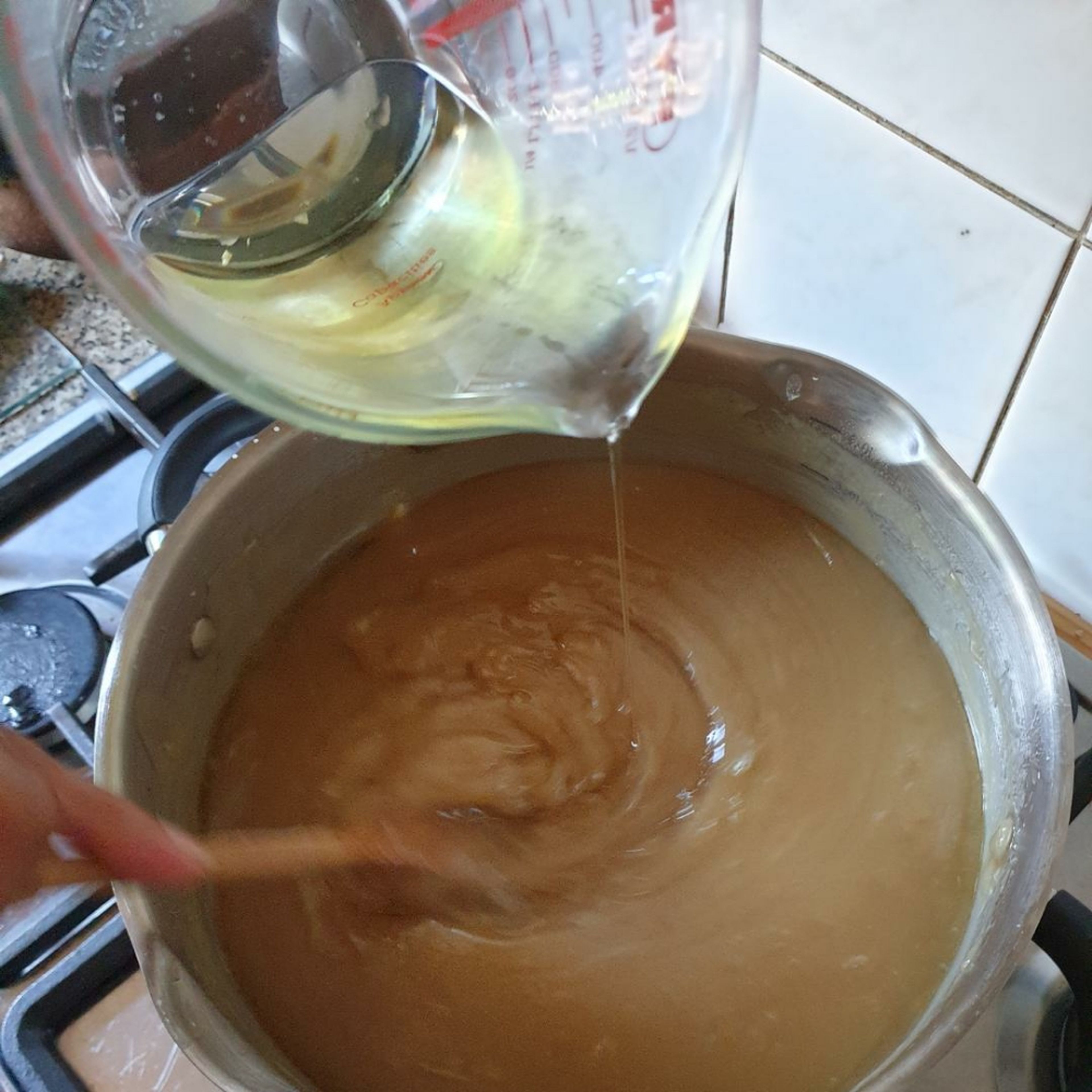 Whilst combining the flour and the sugar, add in the oil.