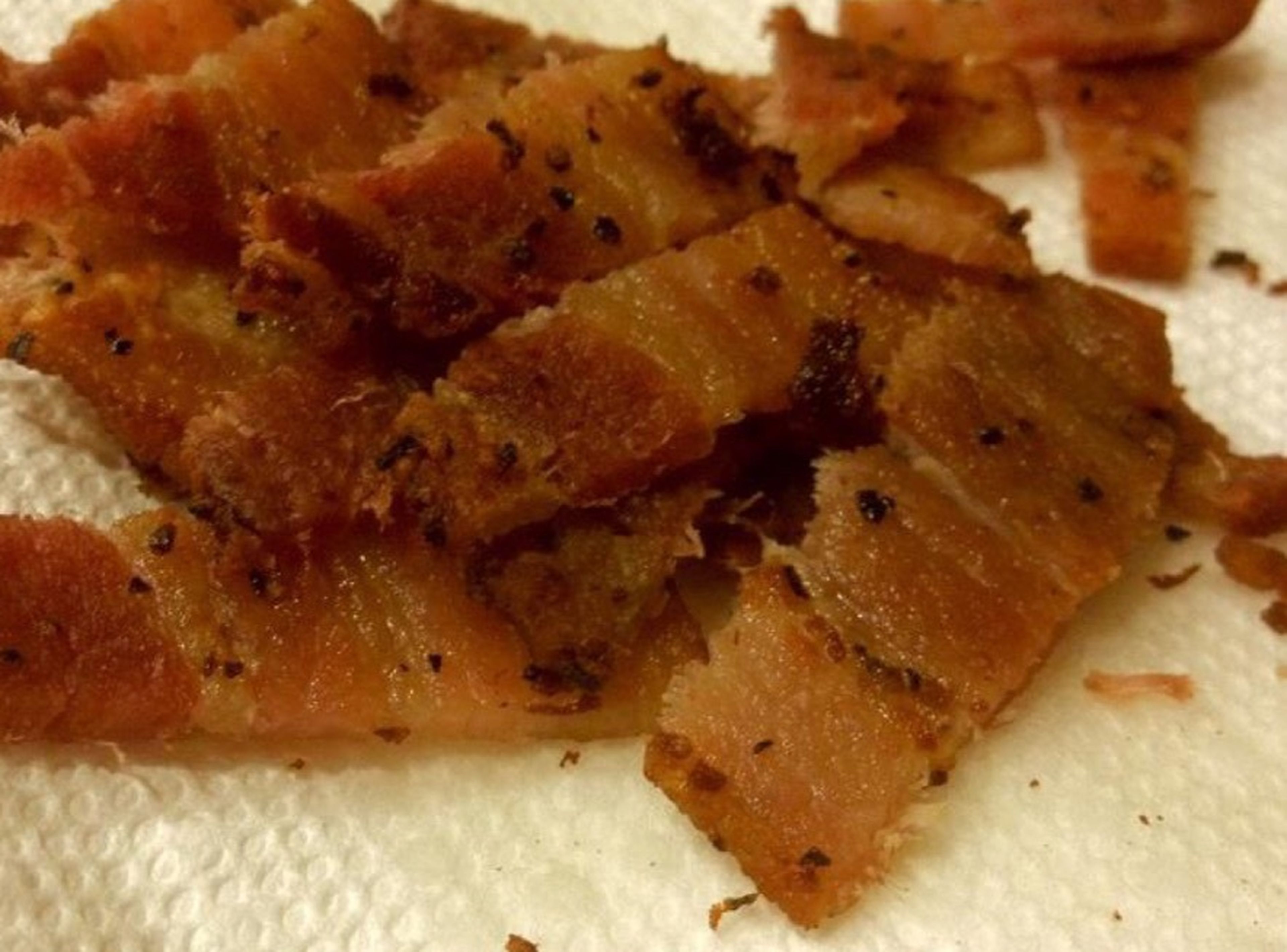 Fry bacon, then remove bacon from the pan. Save the fat for cooking the halibut.