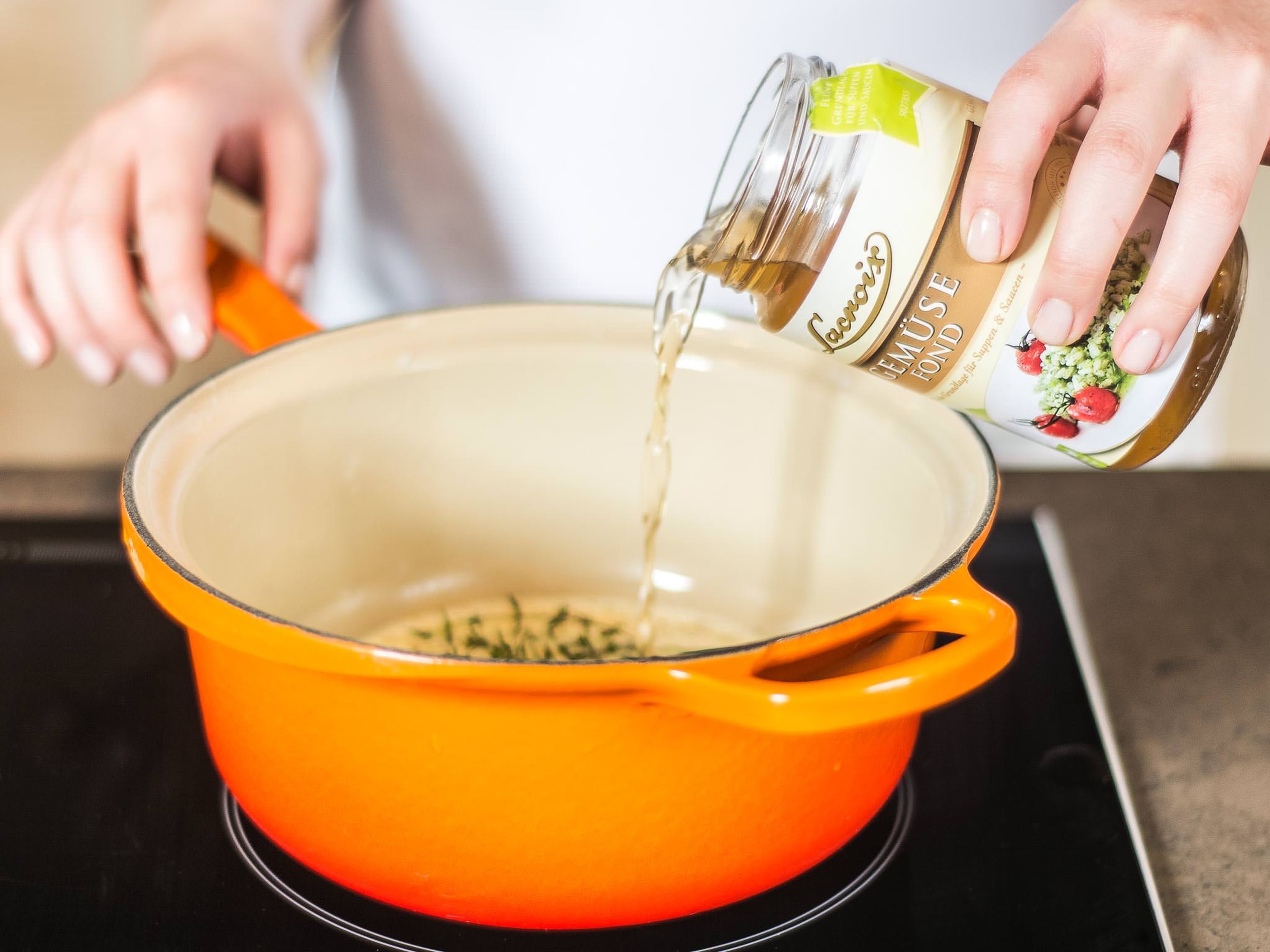 In a small saucepan, bring vegetable stock, heavy cream, thyme, and rosemary to a boil.