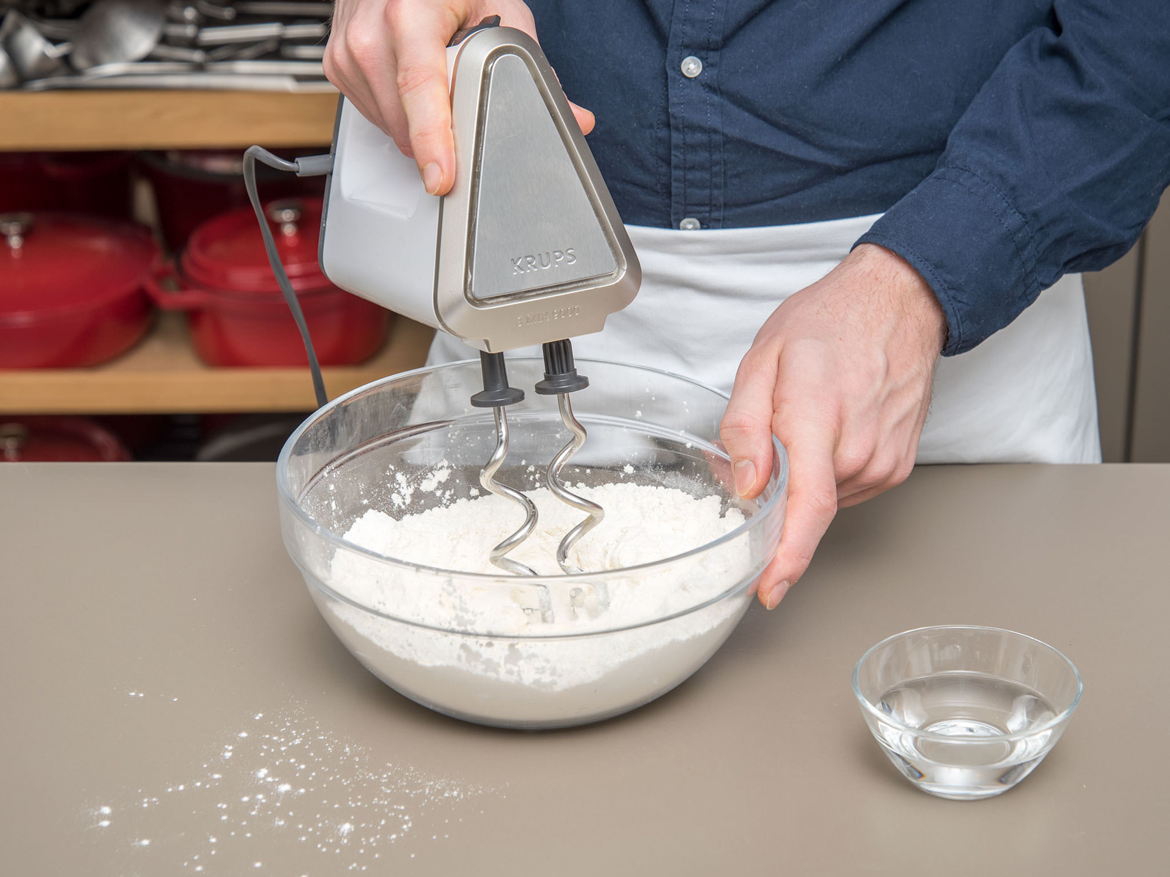 Add flour, salt, sugar, and some of the butter to a bowl and start to knead with a hand mixer with dough hooks. Add water and keep kneading until a soft dough forms. Wrap in plastic wrap and let the dough rest in the fridge until the filling is prepared.