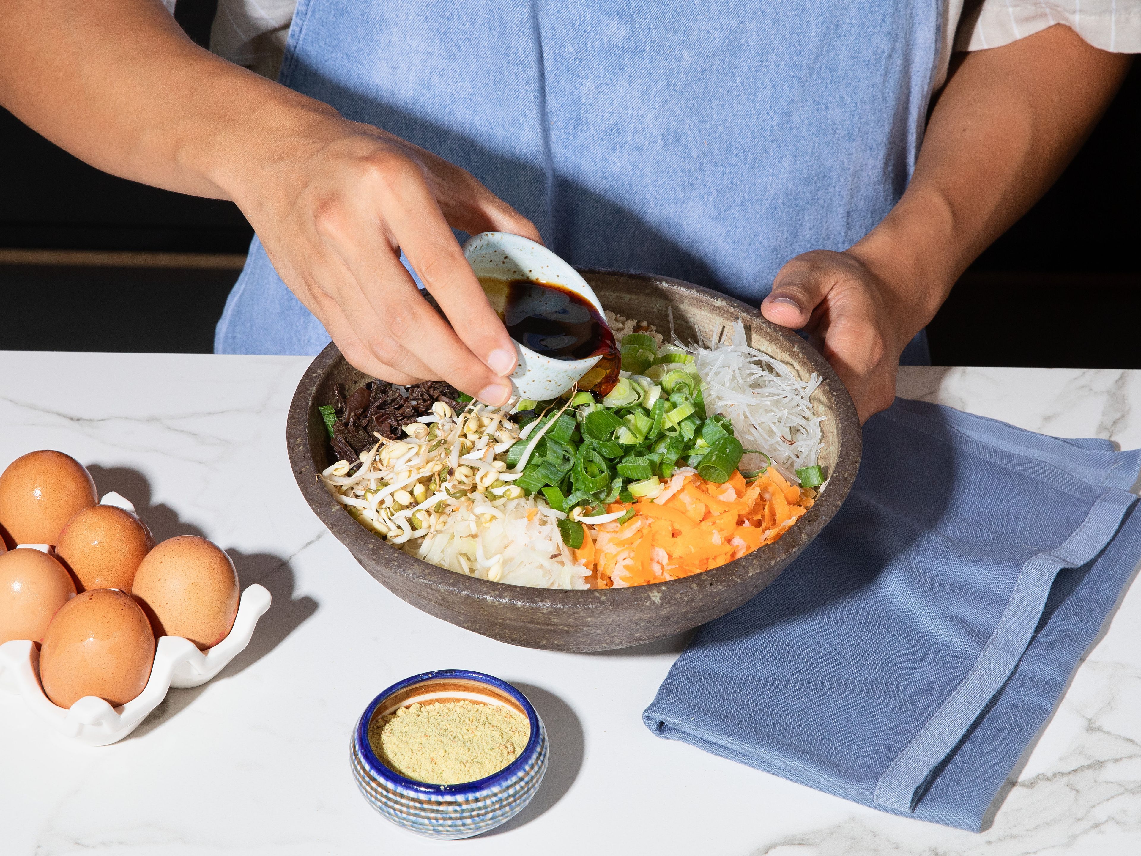 Combine all chopped ingredients in large bowl. Add egg, vegetable broth powder,  soy sauce and a generous pinch of pepper. Mix vigorously so the flavors can meld.