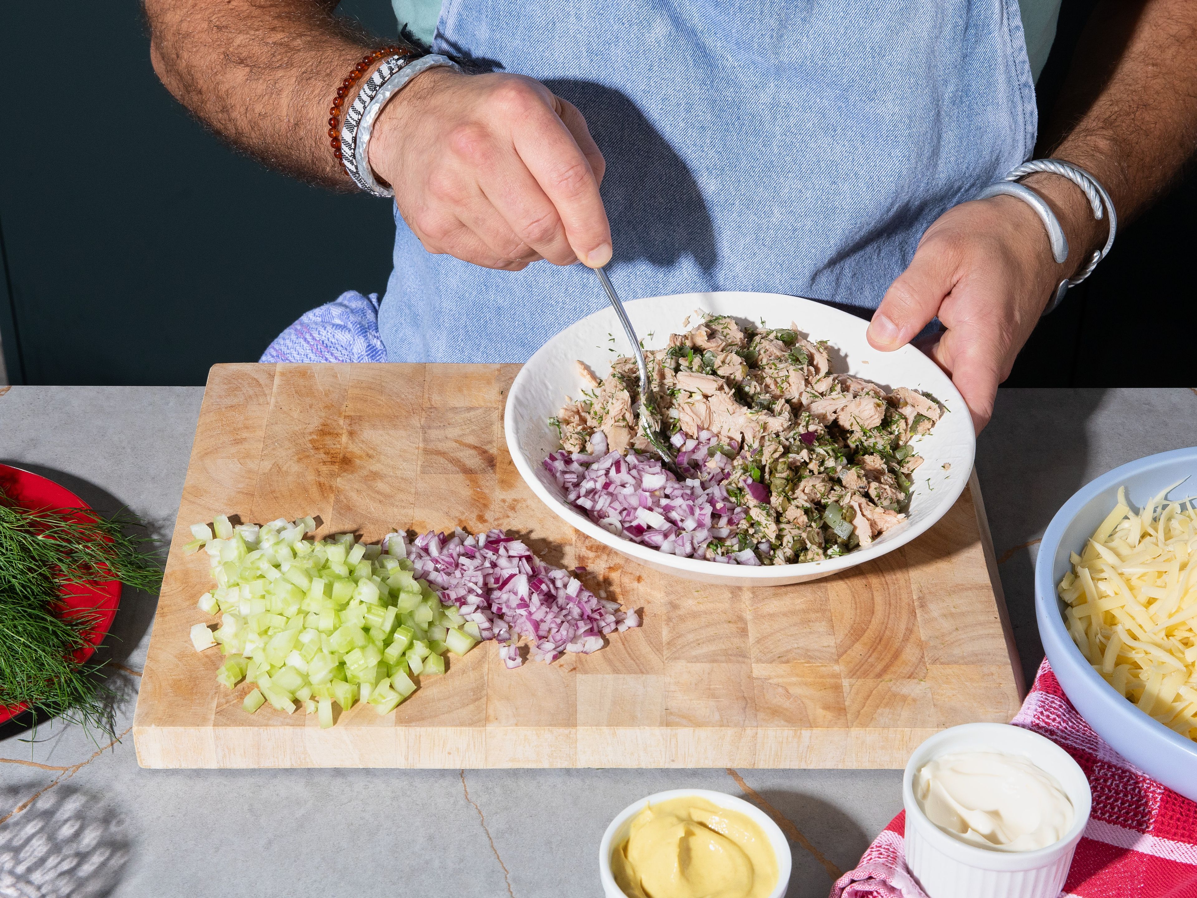 Drain and add tuna to a bowl. Flake and mash thoroughly using a fork. Add onion, celery, capers and dill and stir through. Mix in dijon mustard and mayonnaise. Season generously with pepper and carefully with salt (capers might add significant saltiness).