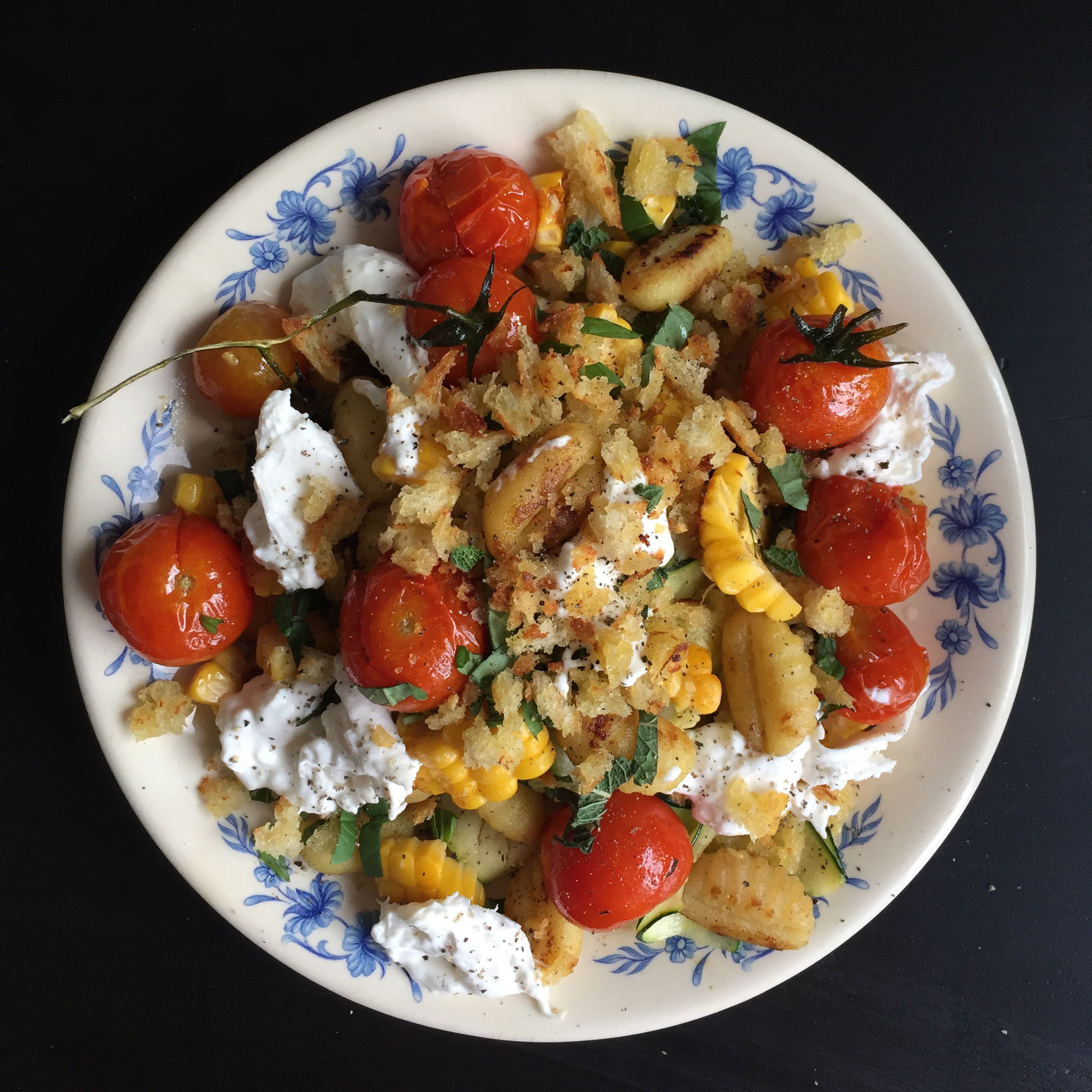 Gnocchi with grilled corn, zucchini, and burrata cheese