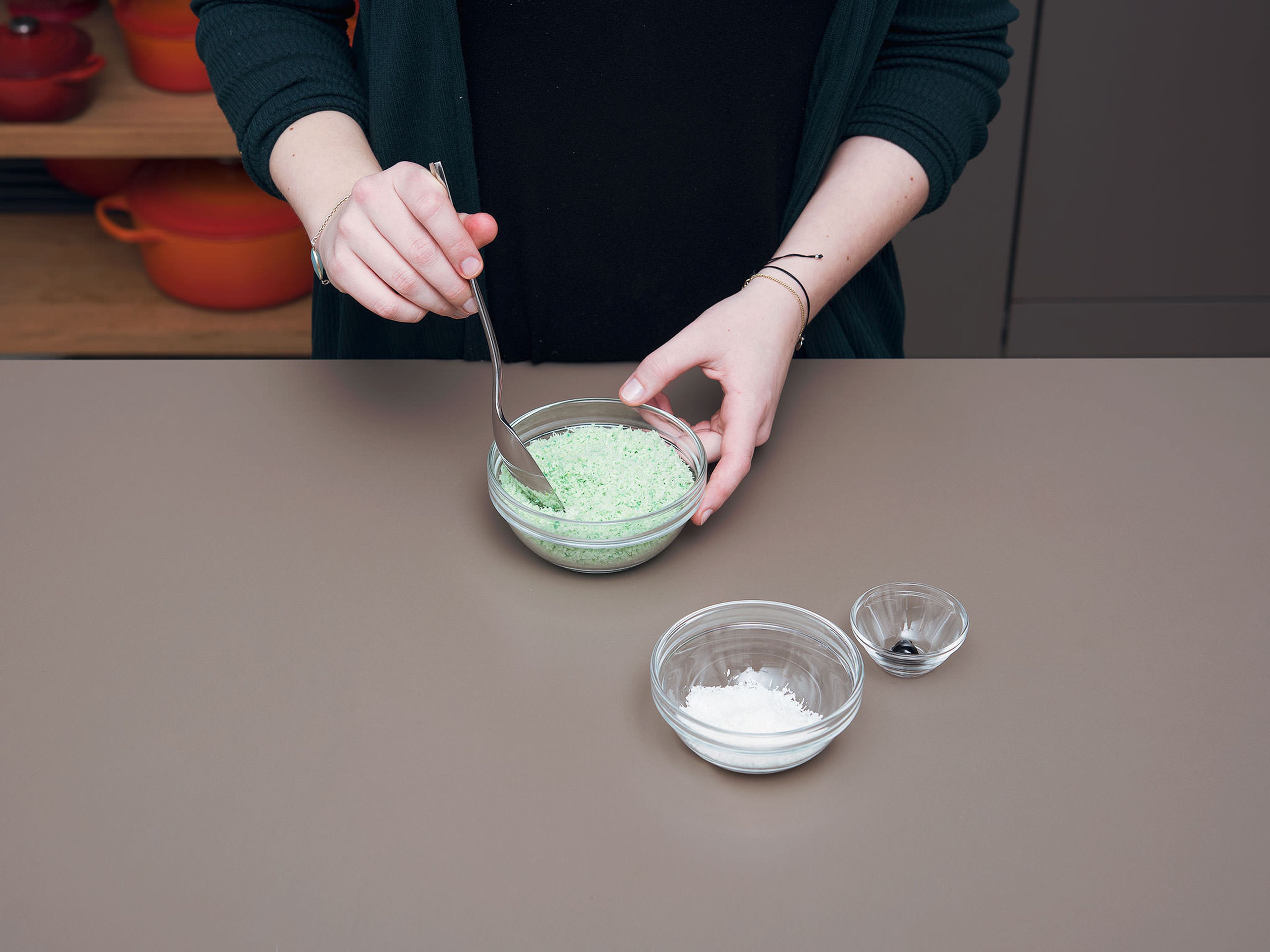 In a small bowl, mix together coconut flakes, green food coloring, and water to make lettuce. Set aside.