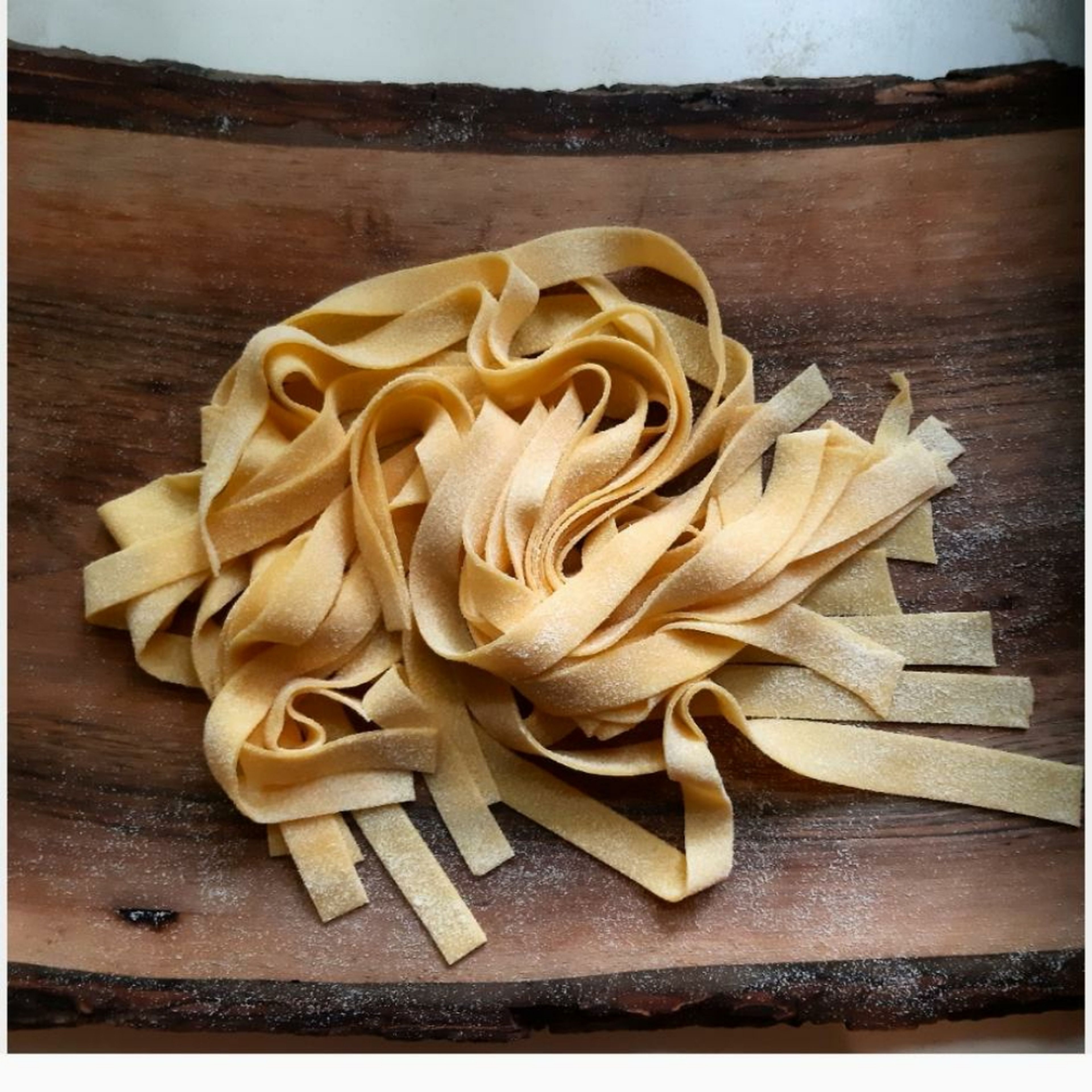 It's very important to leave you pasta to dry a bit before to cook it. It will avoid that gluey feeling. You can use the back of a chair or just your table but make sure to use enough flour.