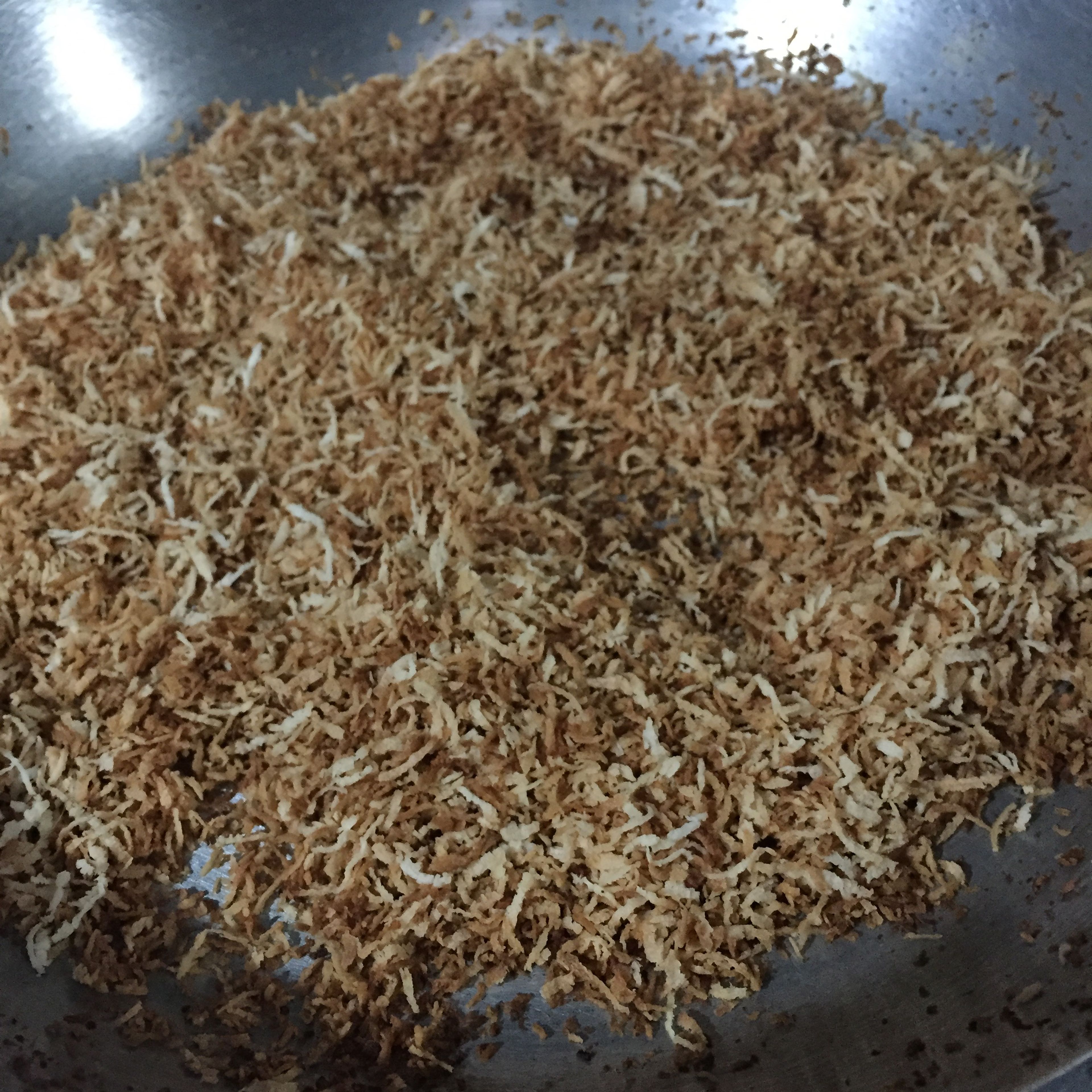 Toasts 1 cup of grated coconut until golden brown and fragrant. Set aside.