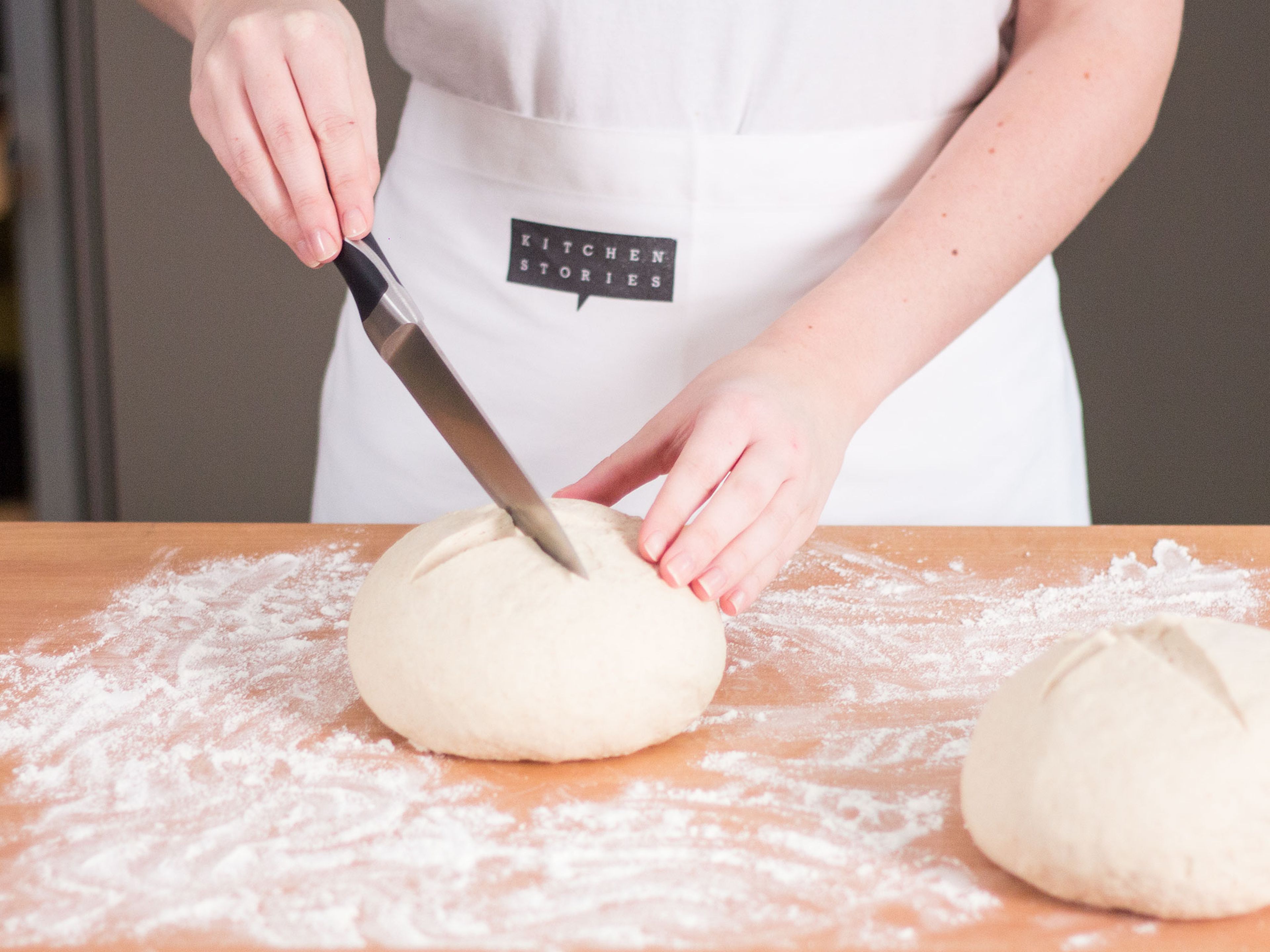 Preheat oven to 220°C/425°F. When dough has finished rising, knead by hand on a floured surface until smooth. Divide dough and form loafs approx. the width of a stretched out hand in diameter. Cover and allow to sit at room temperature on a baking sheet lined with parchment paper for approx. 30 min. When the dough has doubled in volume, make a crosswise incision in the top. Transfer to preheated oven. Place a baking dish filled with water on the bottom rack. Bake the bread for approx. 30 - 40 min. until the crust is golden. Set aside to cool. Serve it with butter and sprinkle with our BUTTERBROT BABY seasoning if liking.