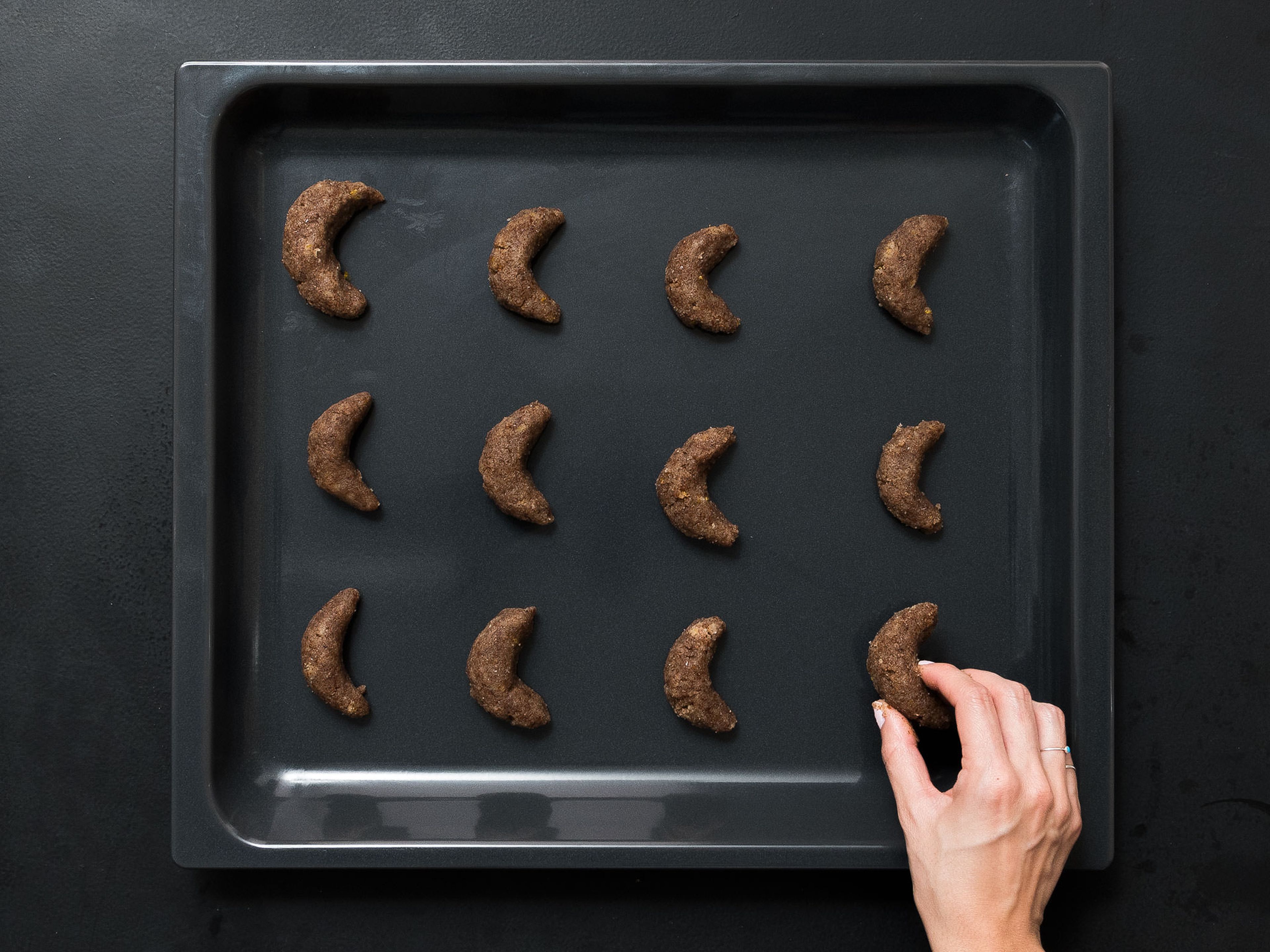 Pre-heat oven to 150°C/300°F. Remove dough from fridge and form into crescent shapes. Place on a baking sheet lined with parchment paper and bake in oven for approx. 15 - 20 min. before removing and setting aside to cool on a wire rack.