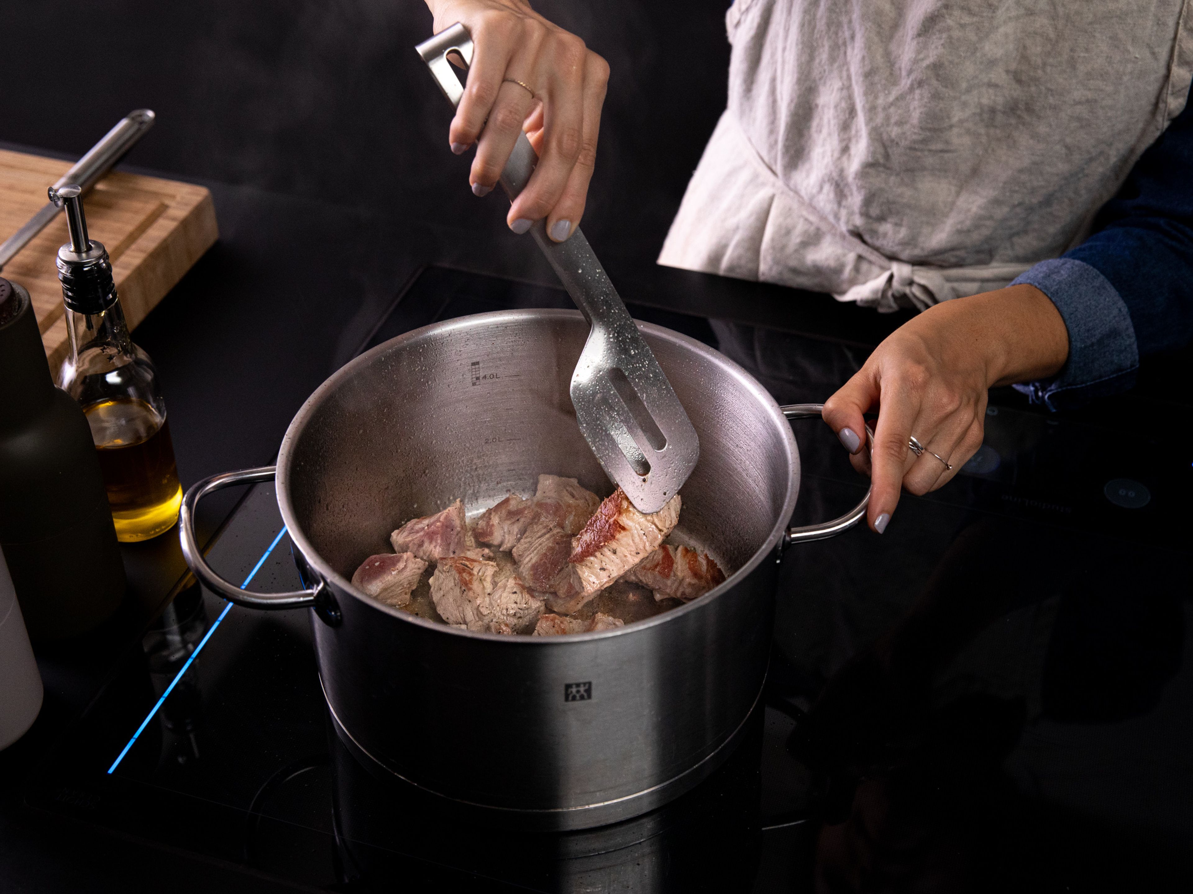 Add some vegetable oil to a large heavy-bottomed pot over medium-high heat. Add the pork, season with salt and pepper, and brown on all sides.