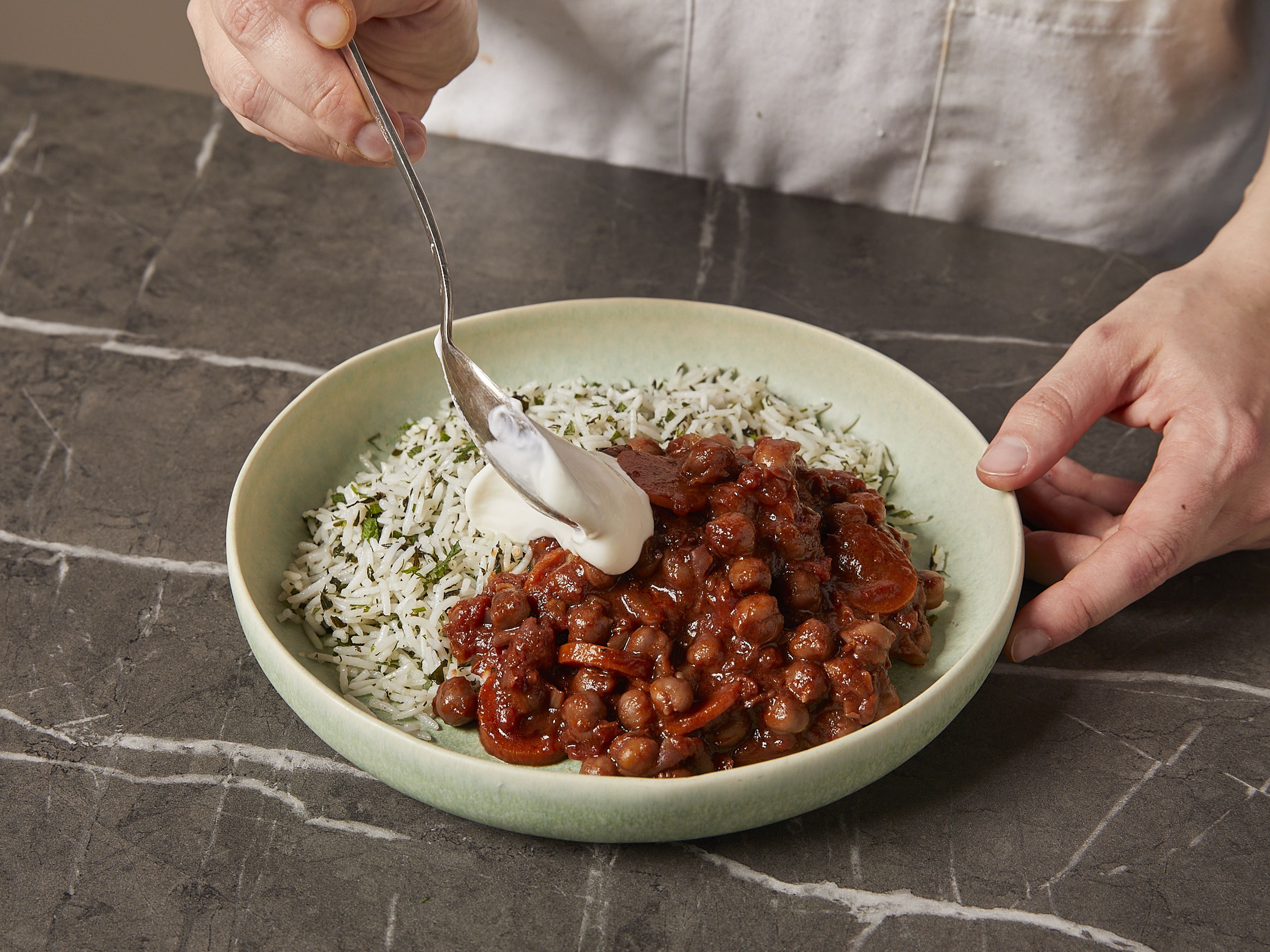 Serve braised chickpeas with the herby rice, a dollop of Greek yogurt and the remaining herbs.