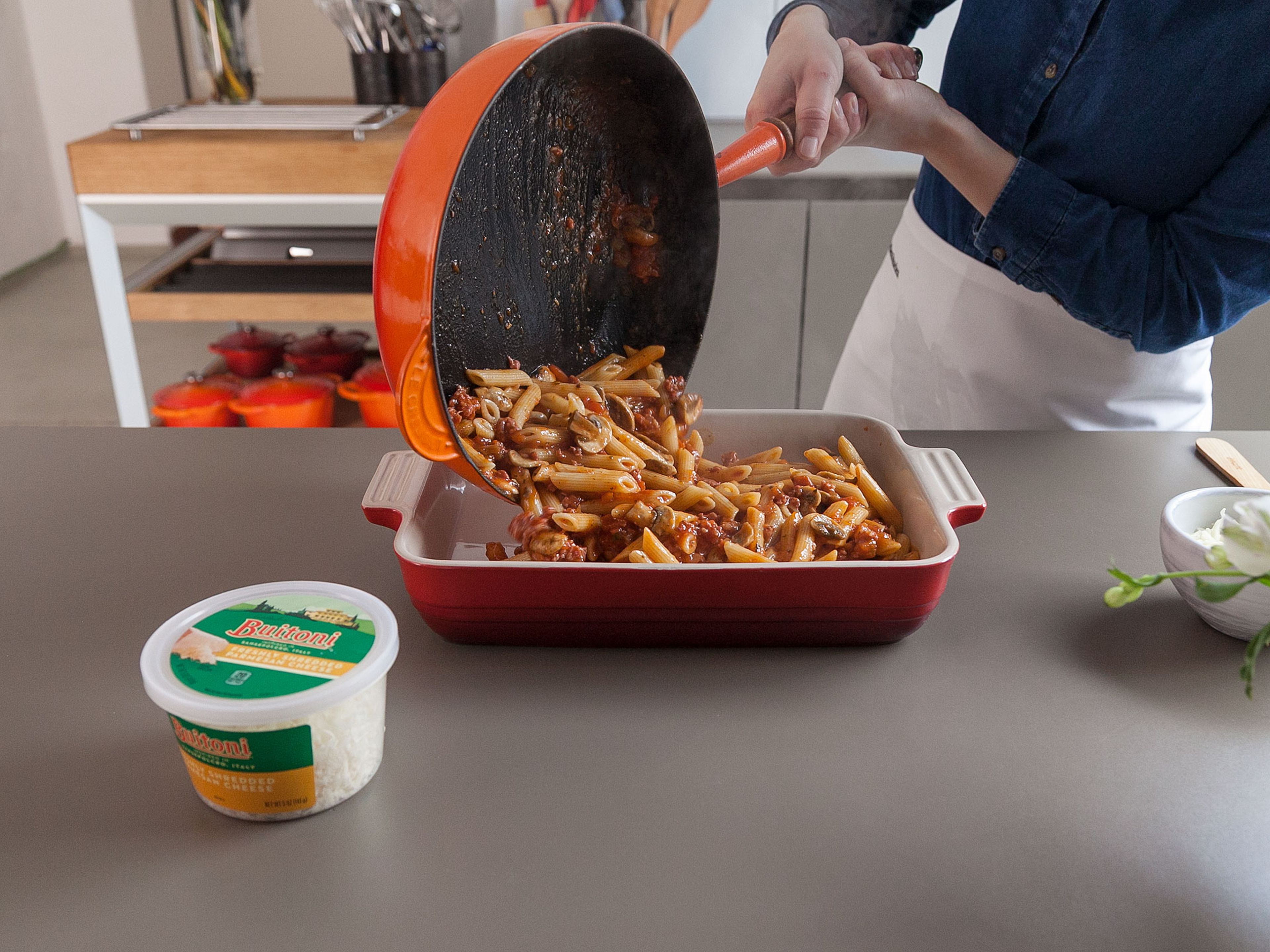 Add cooked pasta to sauce mixture; toss well to coat. Spoon into prepared baking dish.