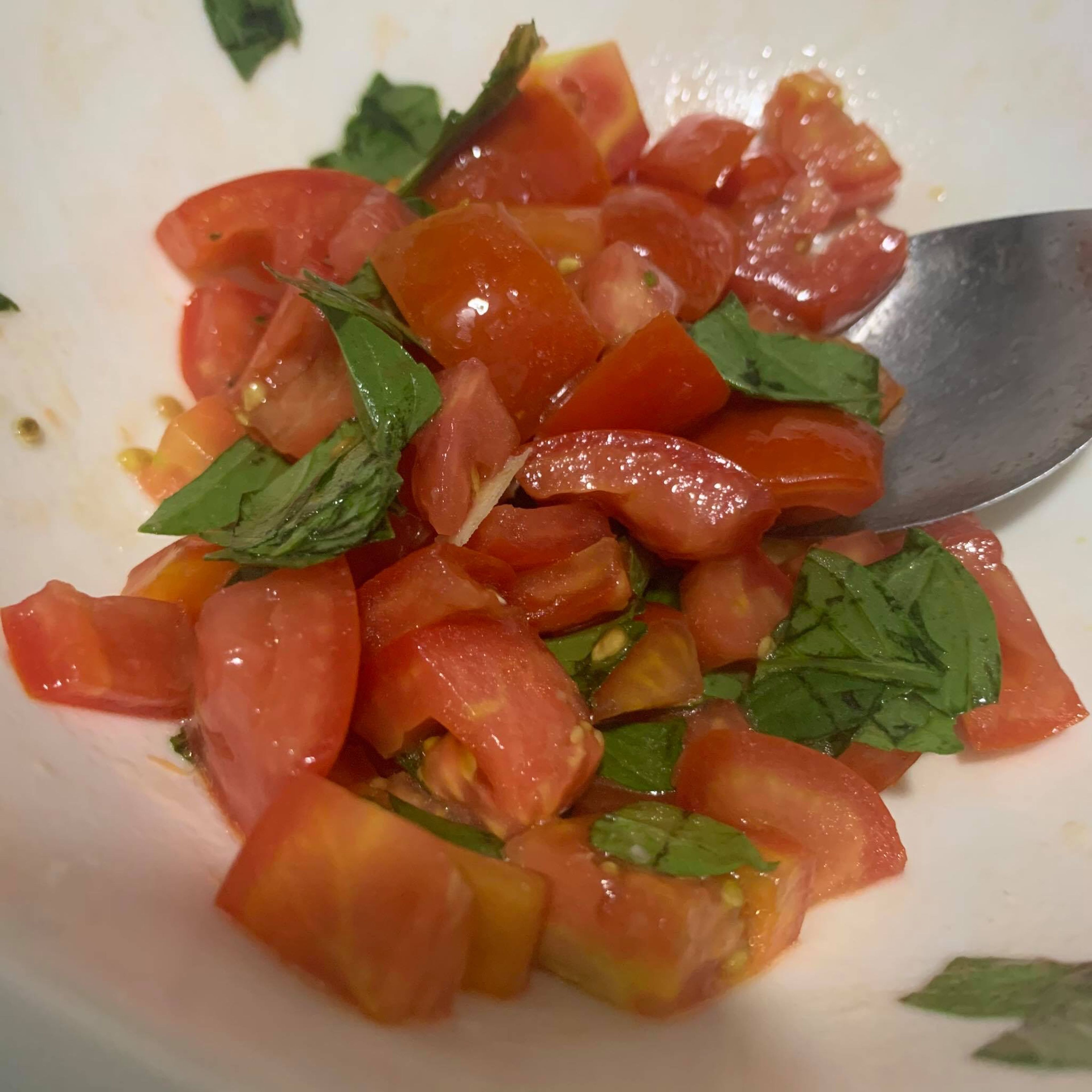 I chopped the tomatoes and cut the sweet basil into this small then mixed it with olive oil and salt. You add it as your taste that’s why I didn’t put how much I used.