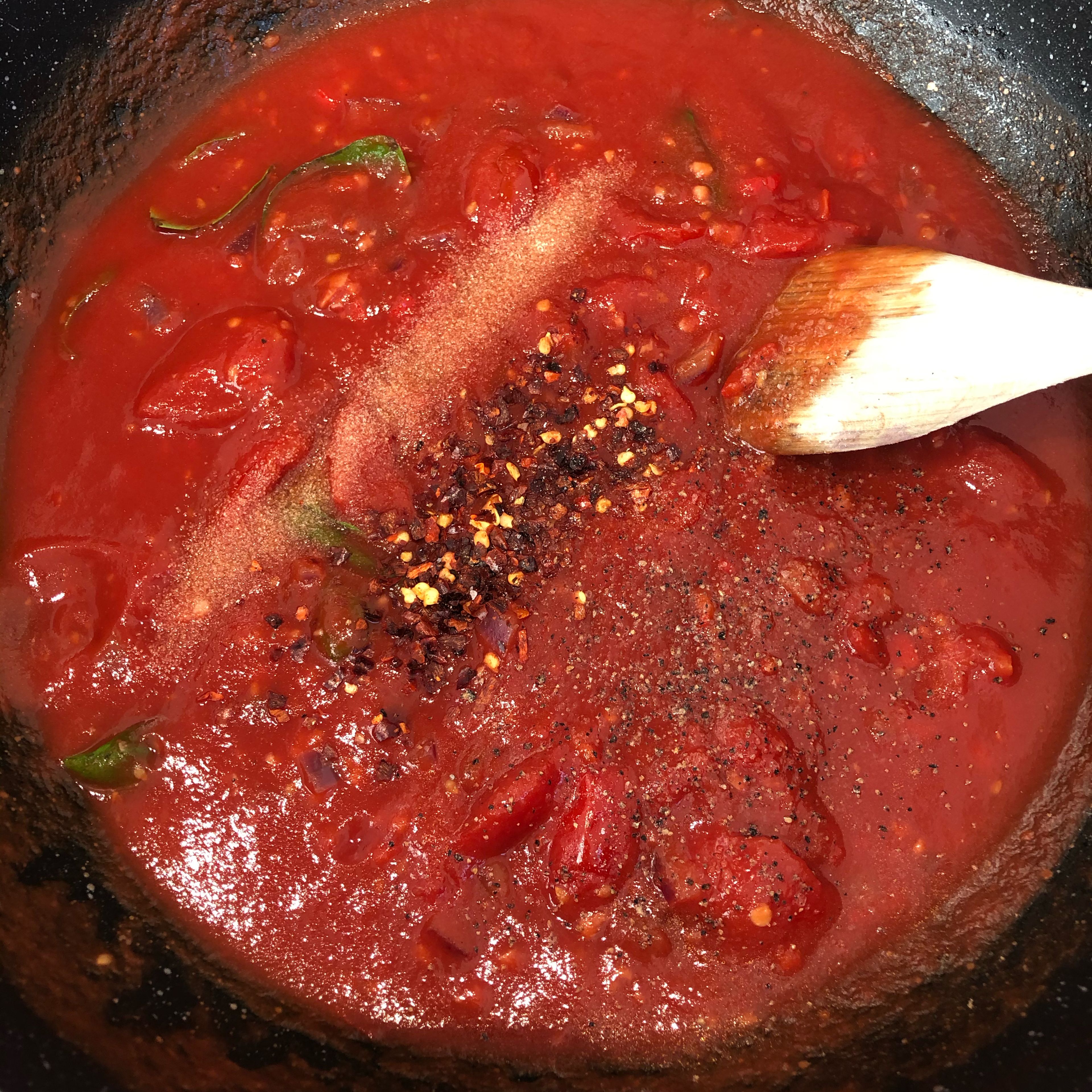 Add chili flakes (and add salt and pepper to the liking of your own taste). Stir on low-medium heat for a bit and add cooked pasta in the sauce pan.