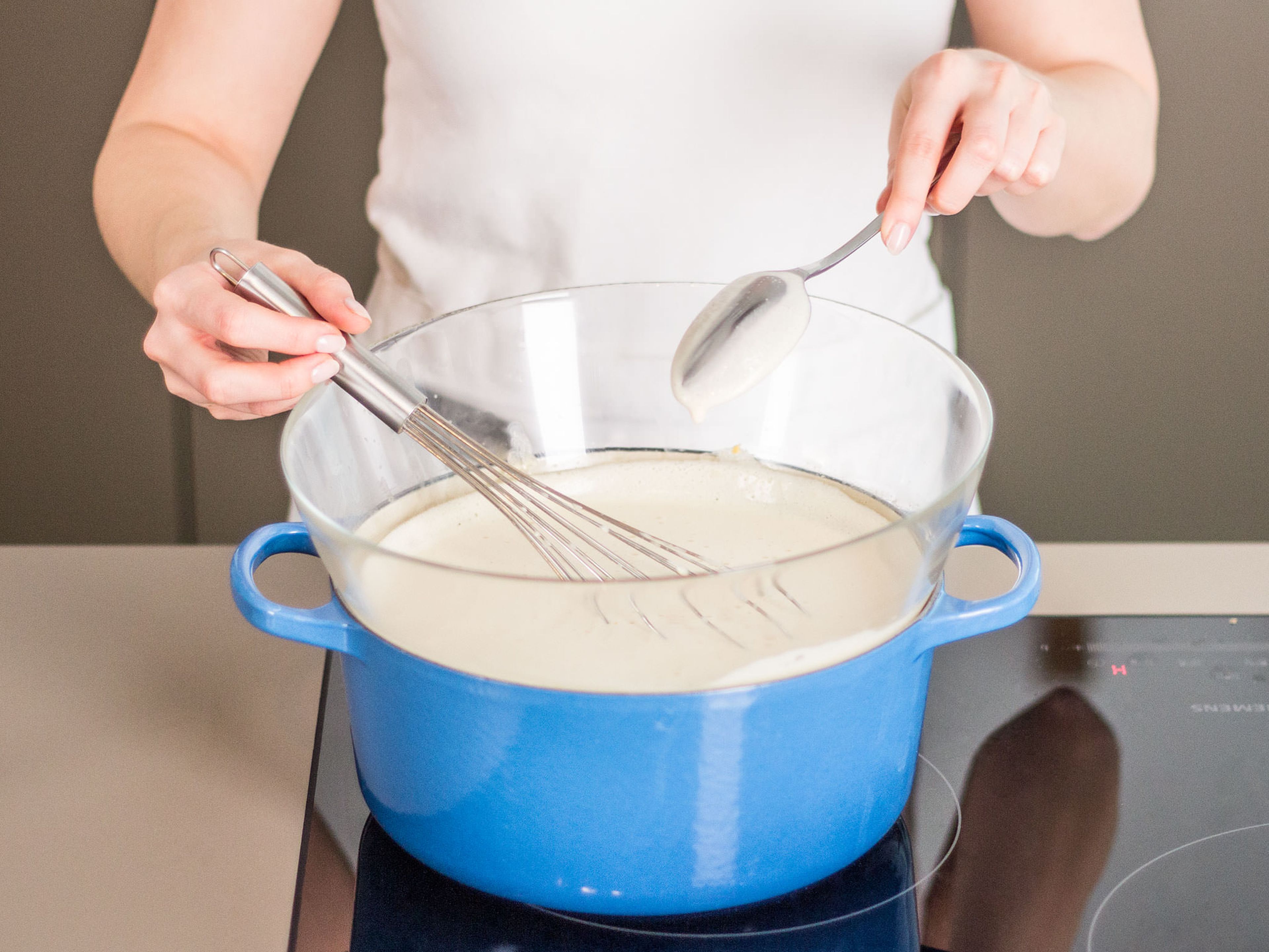 Transfer mixture to a clean bowl and heat over a double boiler, whisking constantly, until thickened slightly. To test for doneness, dip a spoon into the mixture to coat the spoon, then drag your finger down the back; if a clear path remains where your finger was, it’s ready.
