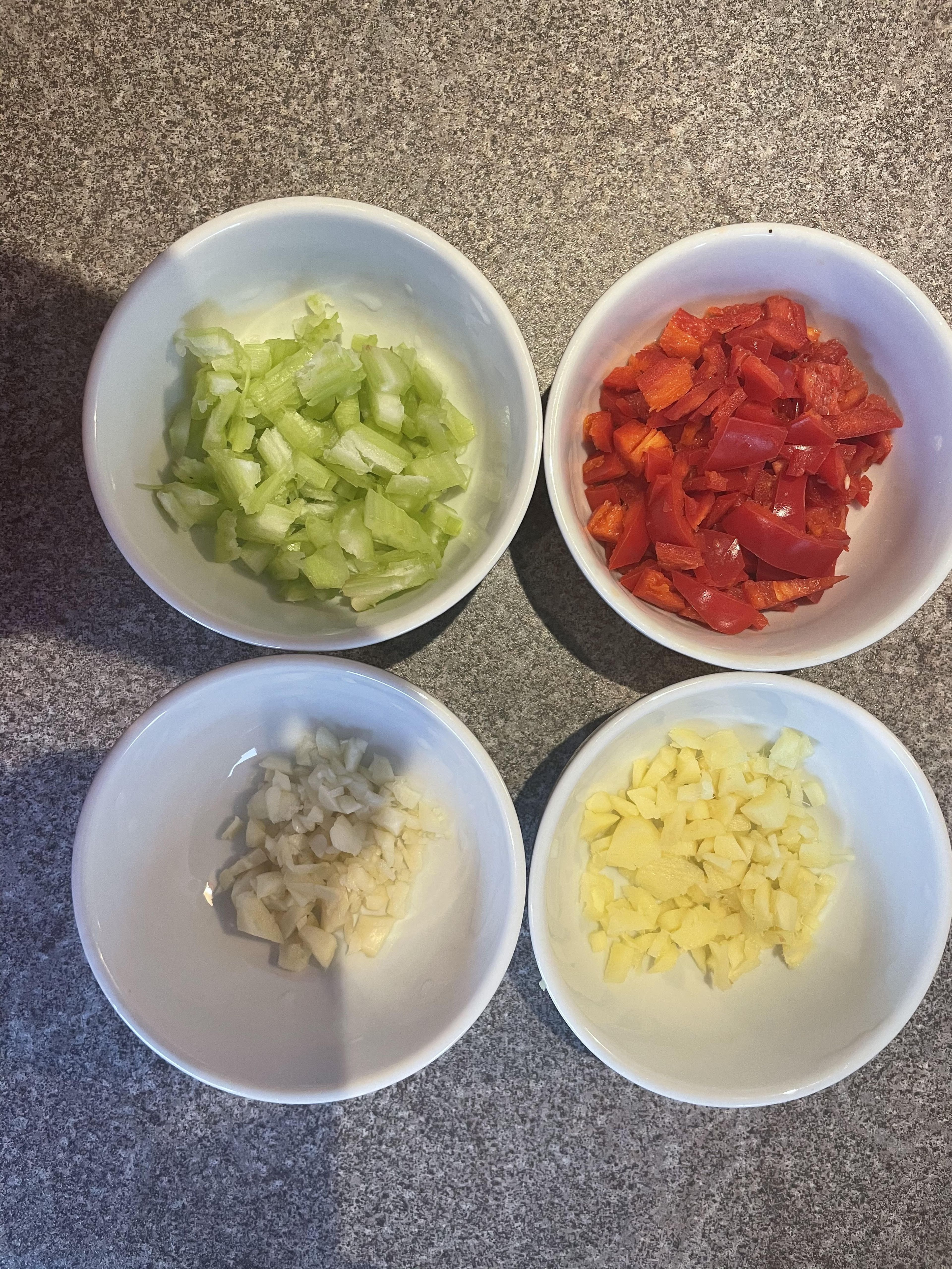 Deseed the chillies and chop finely, after this is done don't forget to wash your hands. Next finely chop the Garlic, Ginger and 1/2 head of celery and place into different pots as shown