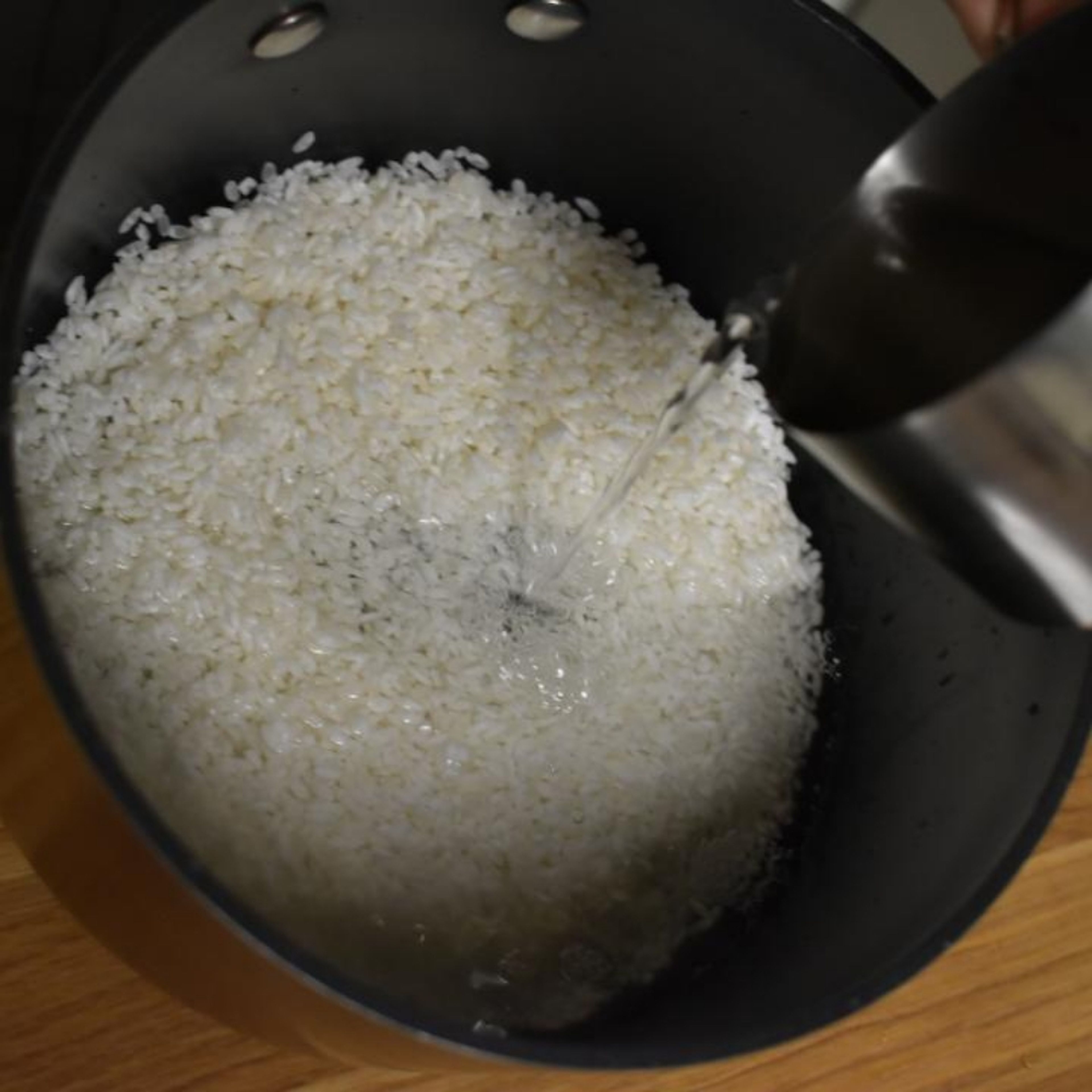 Transfer rice to a pot and add 1 cup of water or just enough to cover it. Bring to a boil. When it starts boiling lower heat to minimum and cover. Let simmer for 15 minutes. Turn off heat and let it rest.