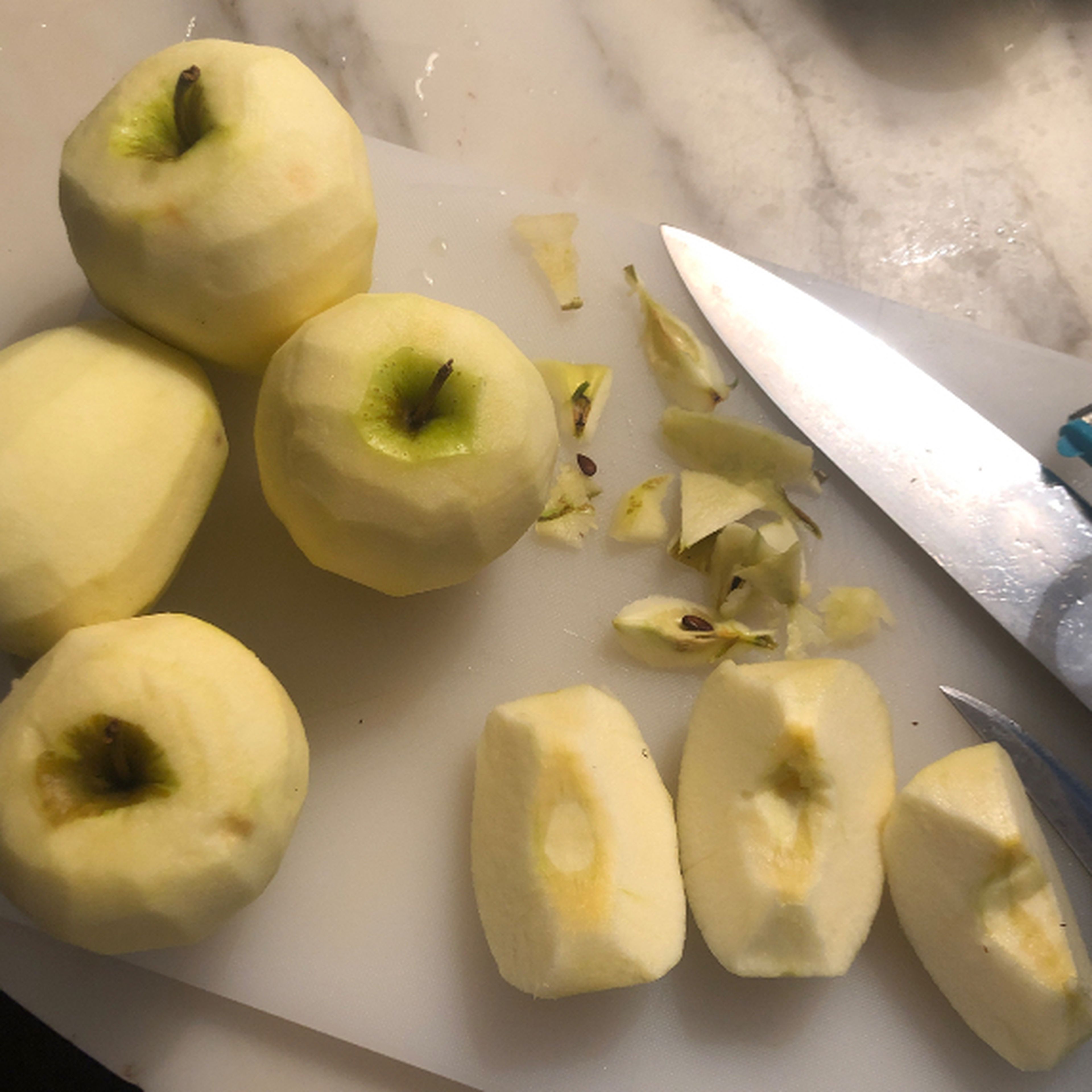 Peel, empty, and cut the apples into quarters (or smaller if desired). Bear in mind these will shrink during baking.