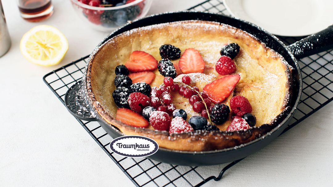 Berry Dutch baby with vanilla sauce