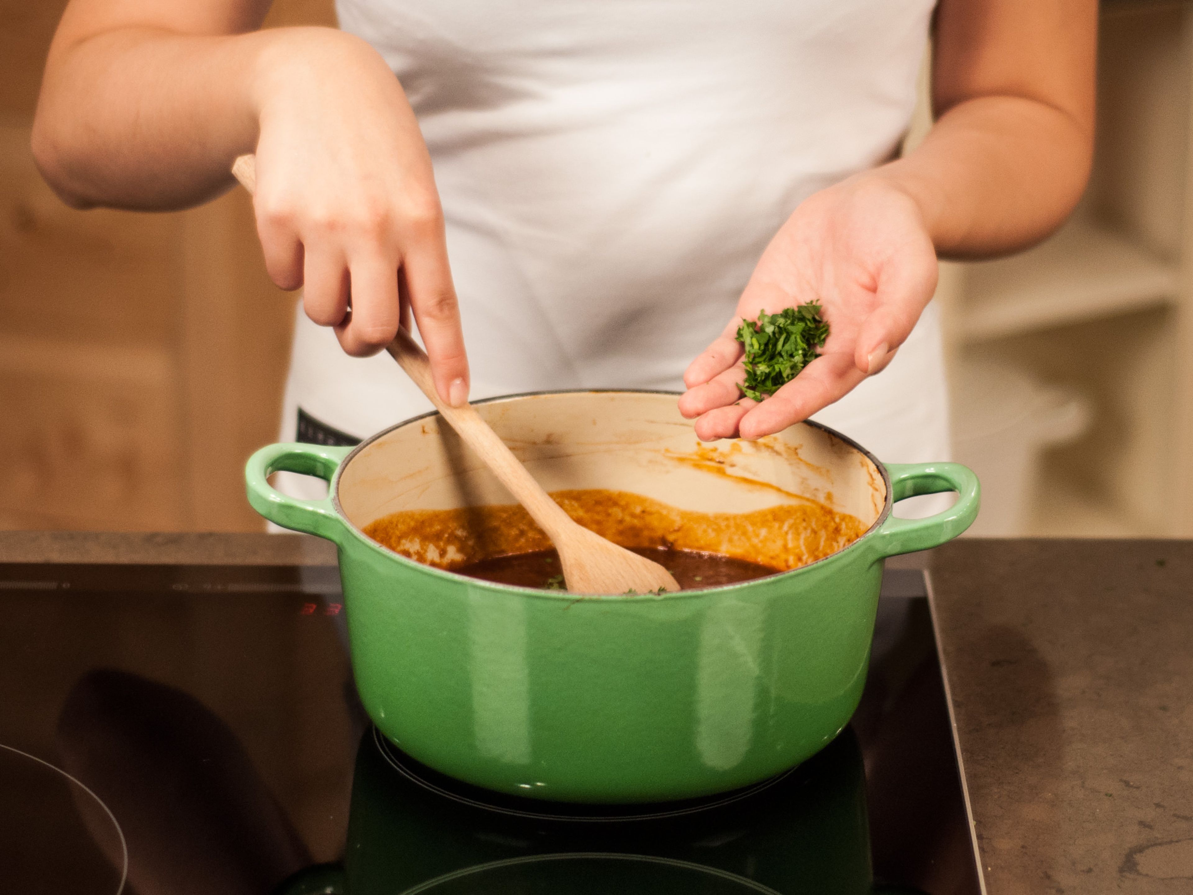 Stir chopped cilantro into sauce.