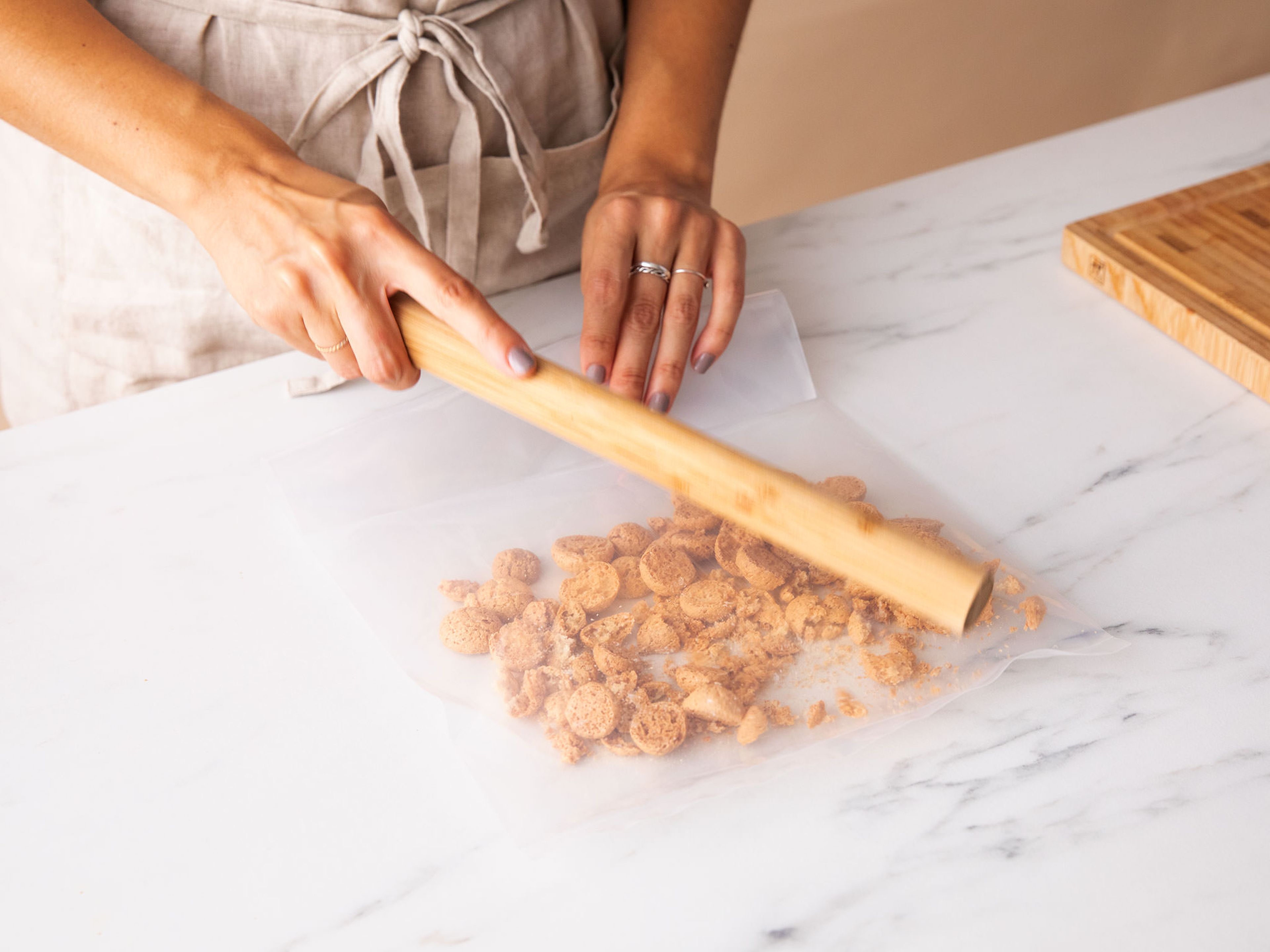 Beat the mascarpone in a bowl with a hand mixer until fluffy. Put amaretti cookies in a resealable freezer bag and bash to pieces with a rolling pin. The cookies pieces should still be chunky, with very little fine powder.