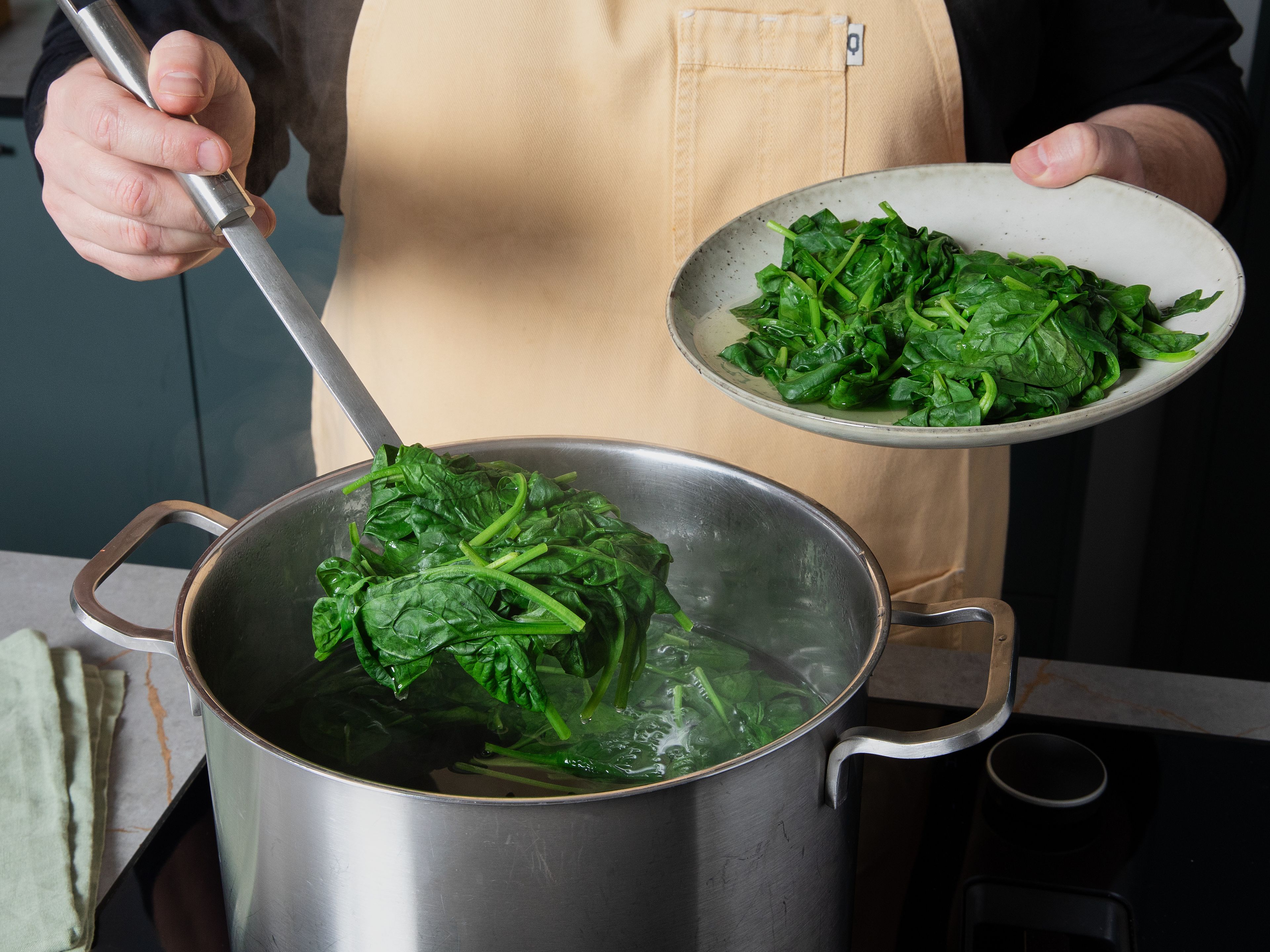 Add the fried mushrooms together with roasted squash cubes, walnuts and Dijon mustard into a blender and blend to a coarse mixture. Briefly blanch the spinach in boiling salted water, then rinse with cold water and squeeze out all the excess liquid from the spinach with your hands.
